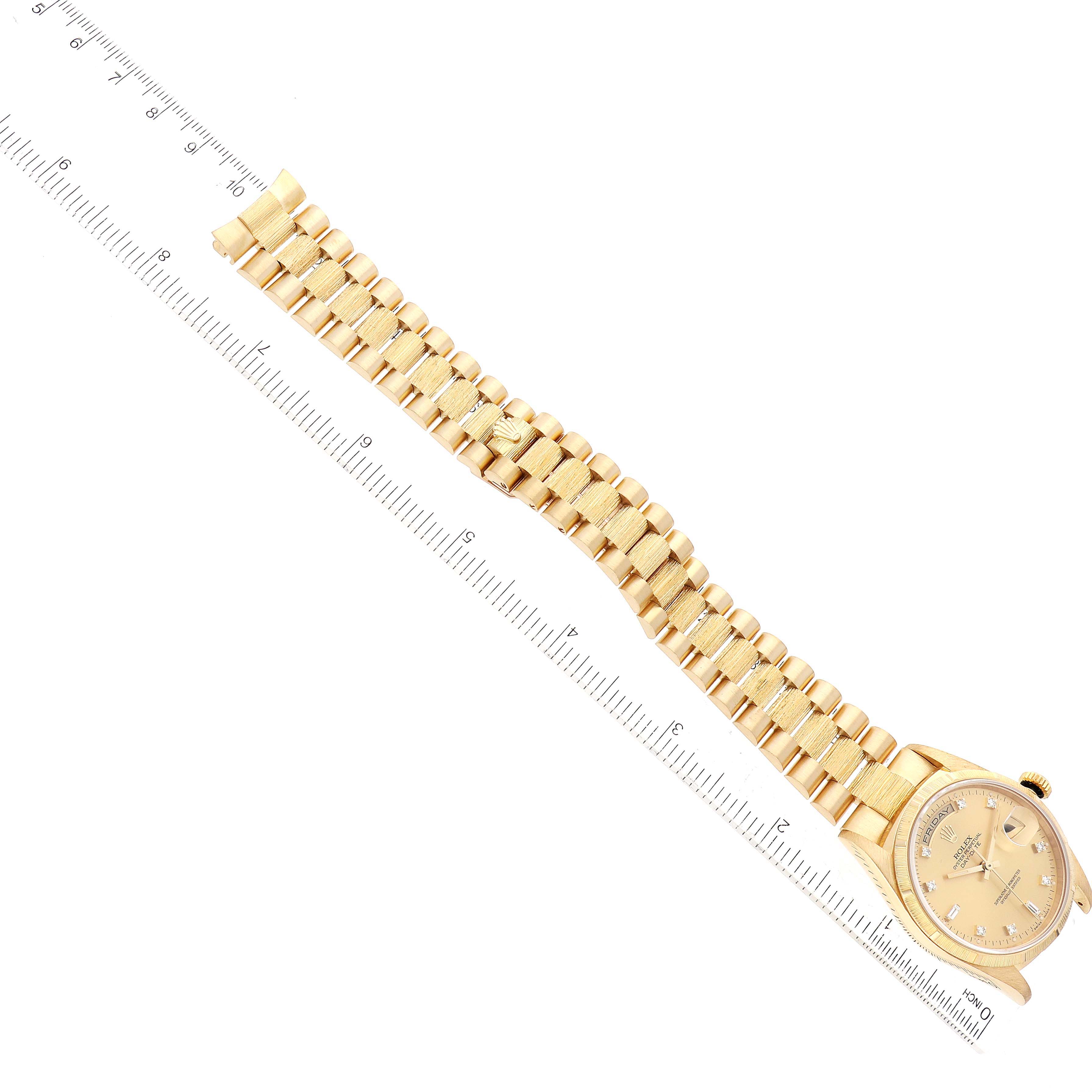 The image shows a Rolex President 18248 Men
s Yellow Gold Champagne Dial 18248 Men
s Yellow Gold Champagne Dial model watch from a top-down angle, displaying the face, entire band, and a ruler for scale.