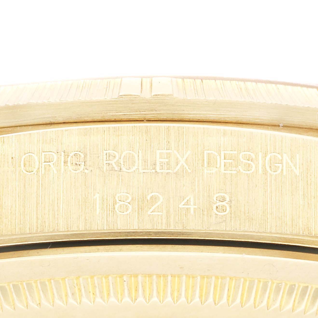The image shows a close-up of the case back and edge, revealing the engraving "Orig Rolex Design 18248" on the Rolex President 18248 Men
s Yellow Gold Champagne Dial 18248 Men
s Yellow Gold Champagne Dial watch.