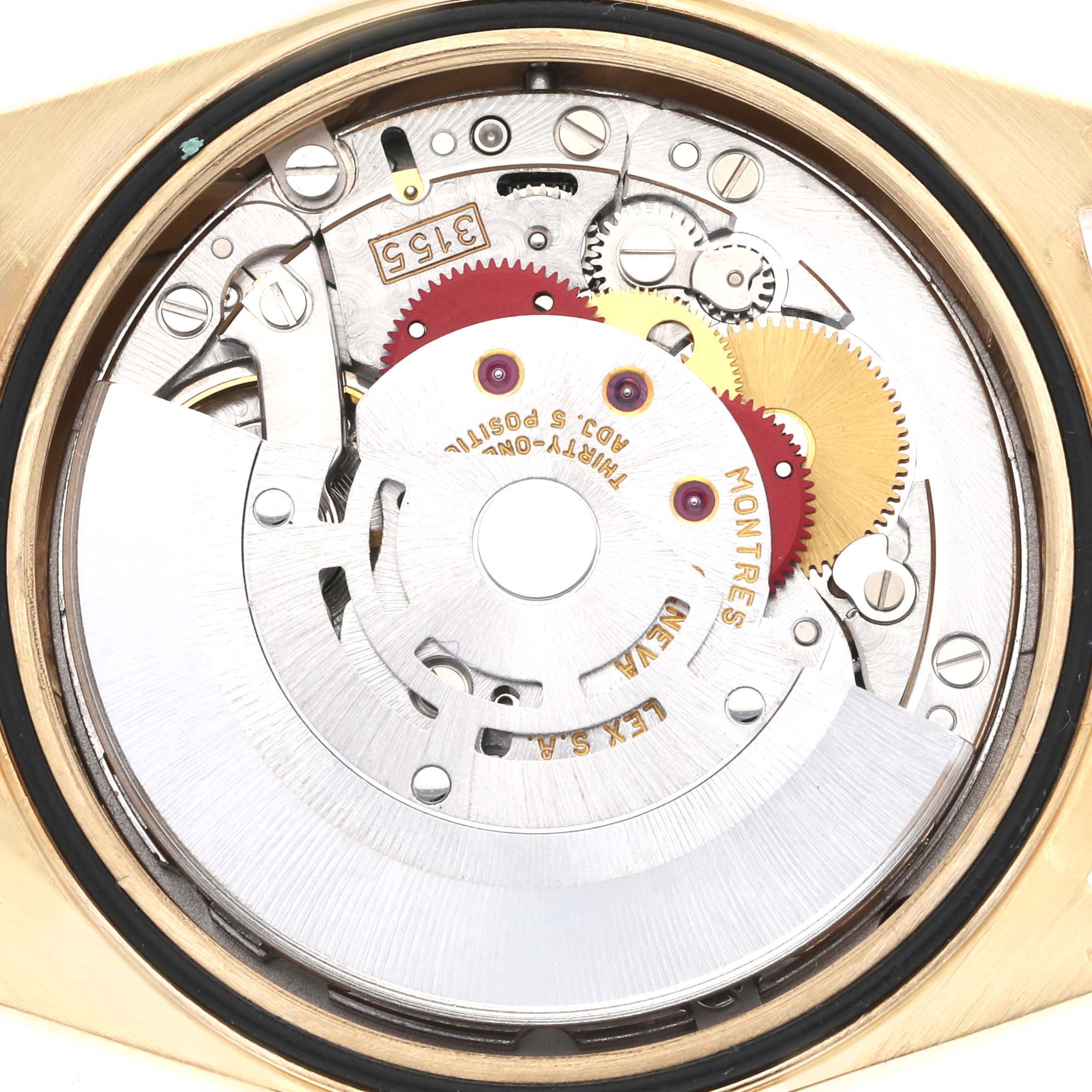 This is a close-up view of the internal mechanism of a Rolex President 18238 Men
s Yellow Gold Champagne Dial 18238 Men
s Yellow Gold Champagne Dial model watch, showing gears and intricate components.