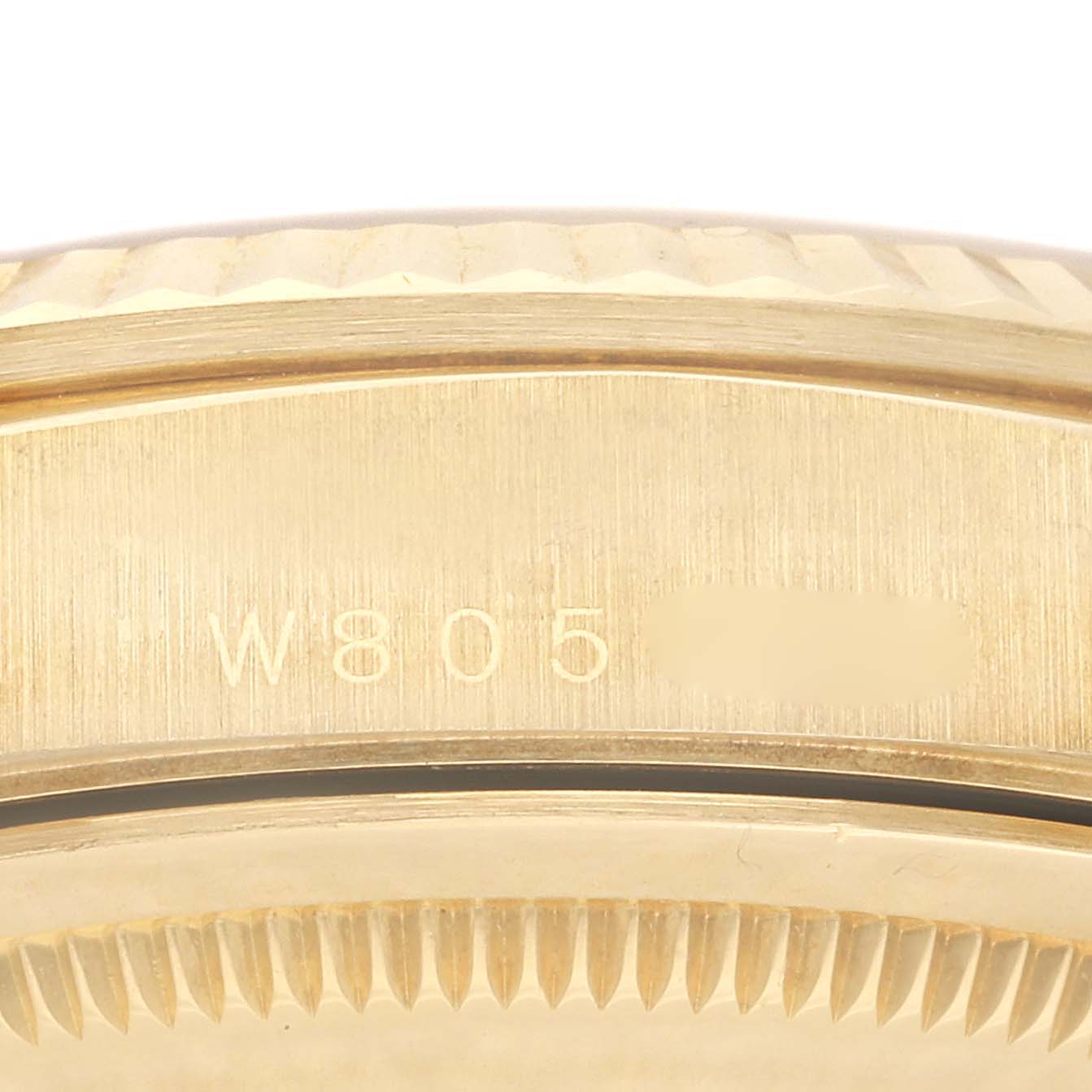 This image shows a close-up of the caseback and the serial number of a Rolex President 18238 Men
s Yellow Gold Champagne Dial 18238 Men
s Yellow Gold Champagne Dial model watch.