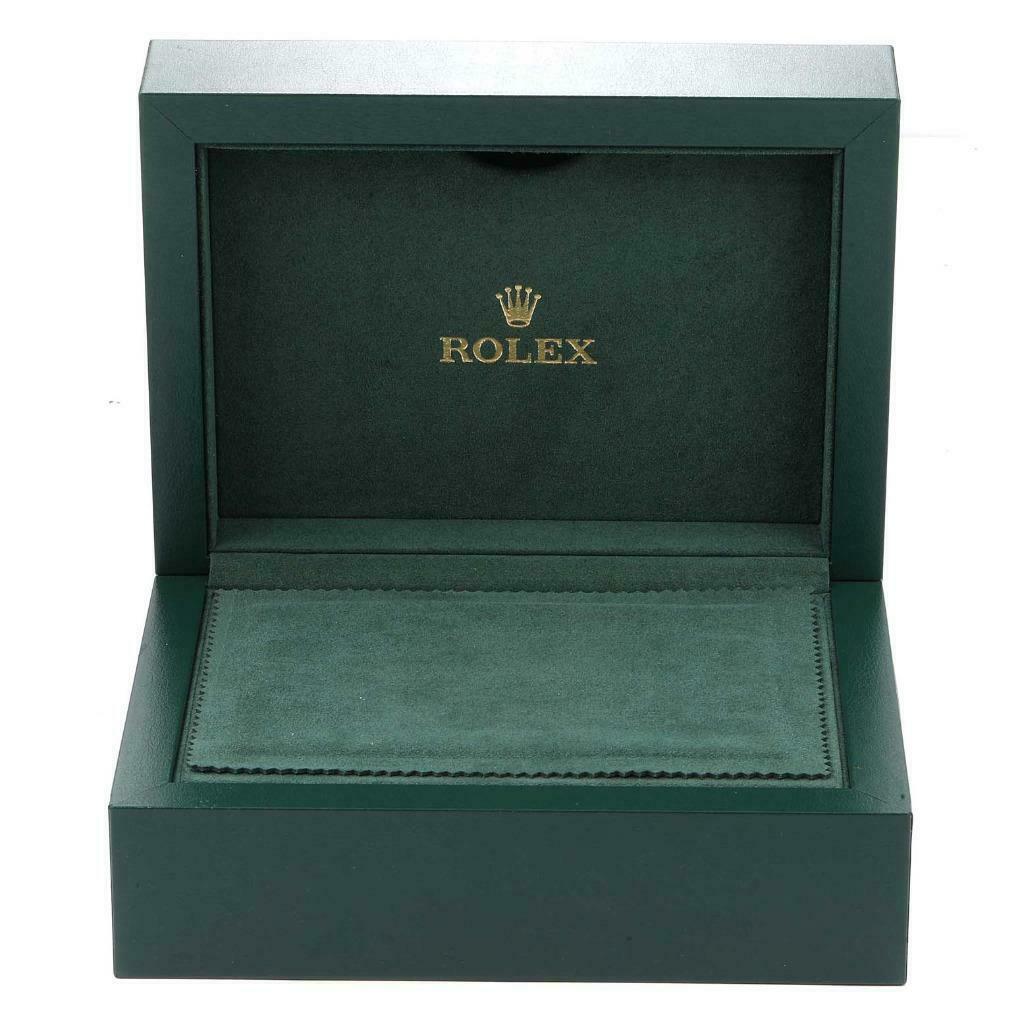 This image shows an open green box designed for a Rolex President 18238 Men
s Yellow Gold Champagne Dial 18238 Men
s Yellow Gold Champagne Dial watch, displaying the interior lining and Rolex logo.