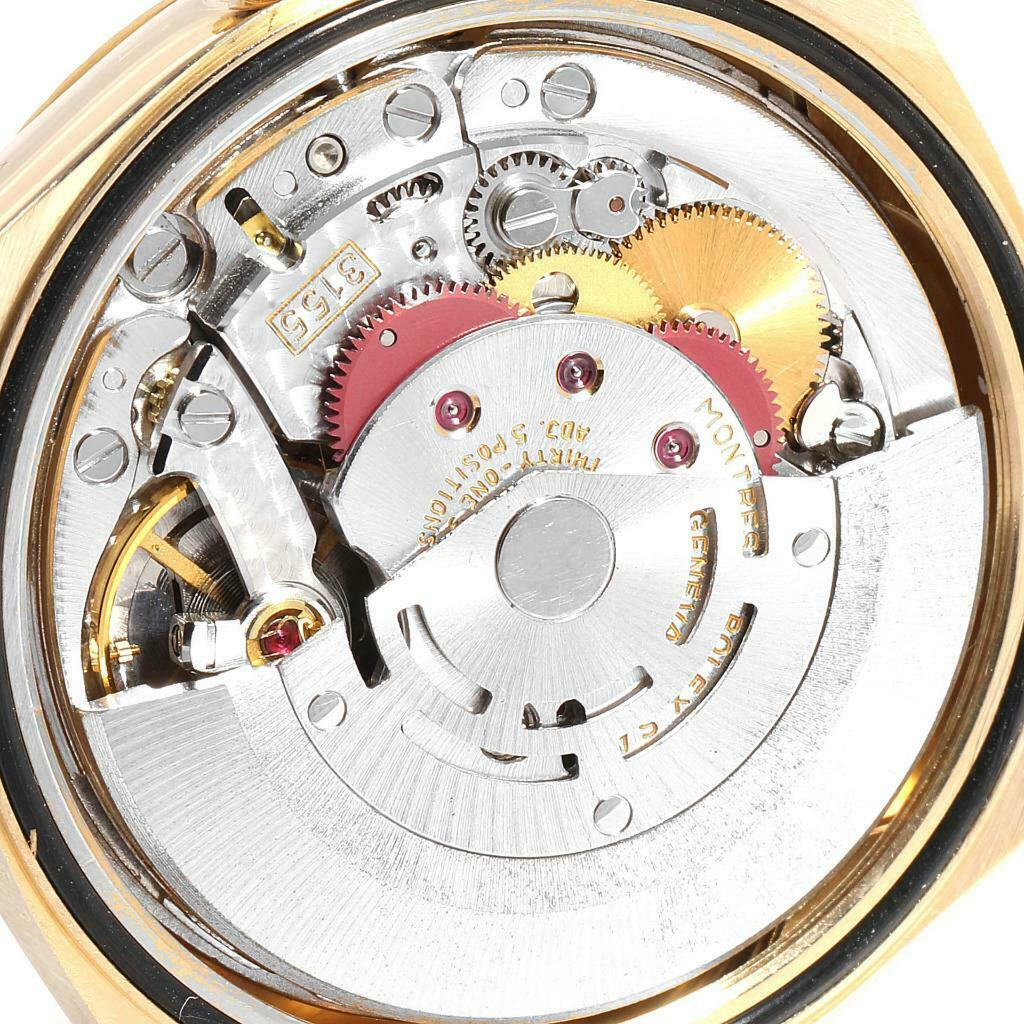 This image shows the internal mechanism of a Rolex President 18238 Men
s Yellow Gold Champagne Dial 18238 Men
s Yellow Gold Champagne Dial watch, highlighting the gears and movement components.