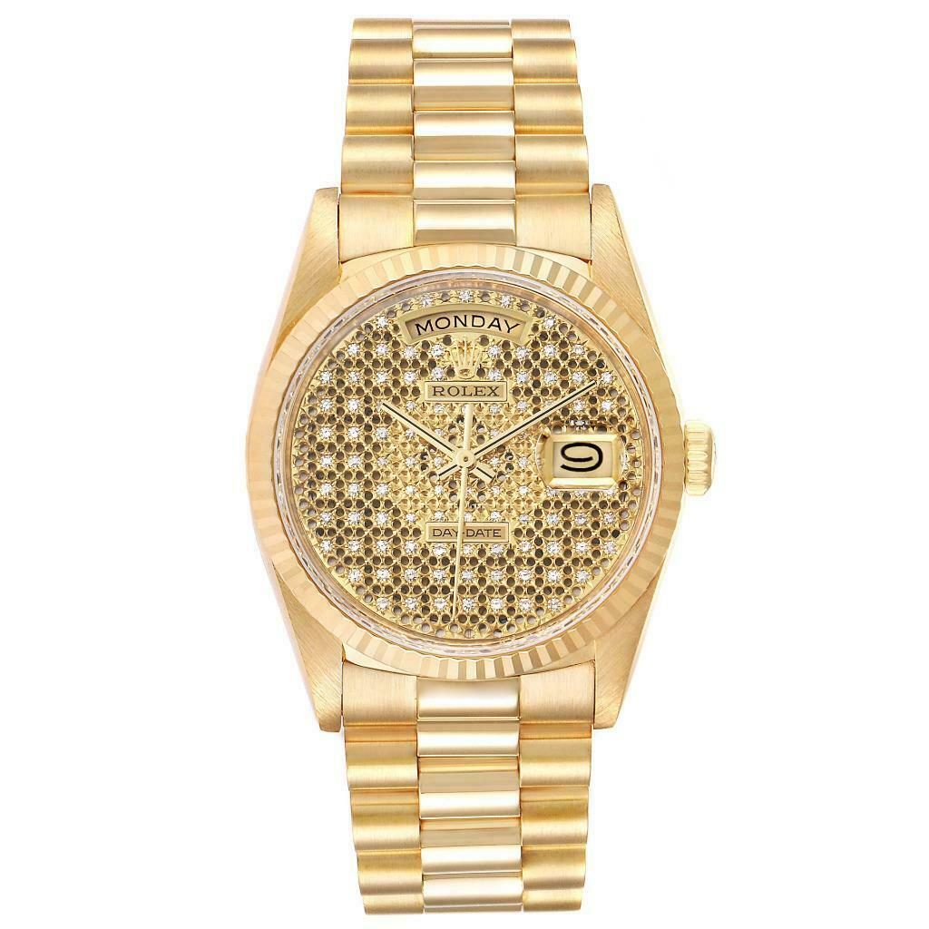 The image shows a front view of a gold Rolex President 18238 Men
s Yellow Gold Champagne Dial 18238 Men
s Yellow Gold Champagne Dial model watch, displaying the day, date, and intricate dial design.