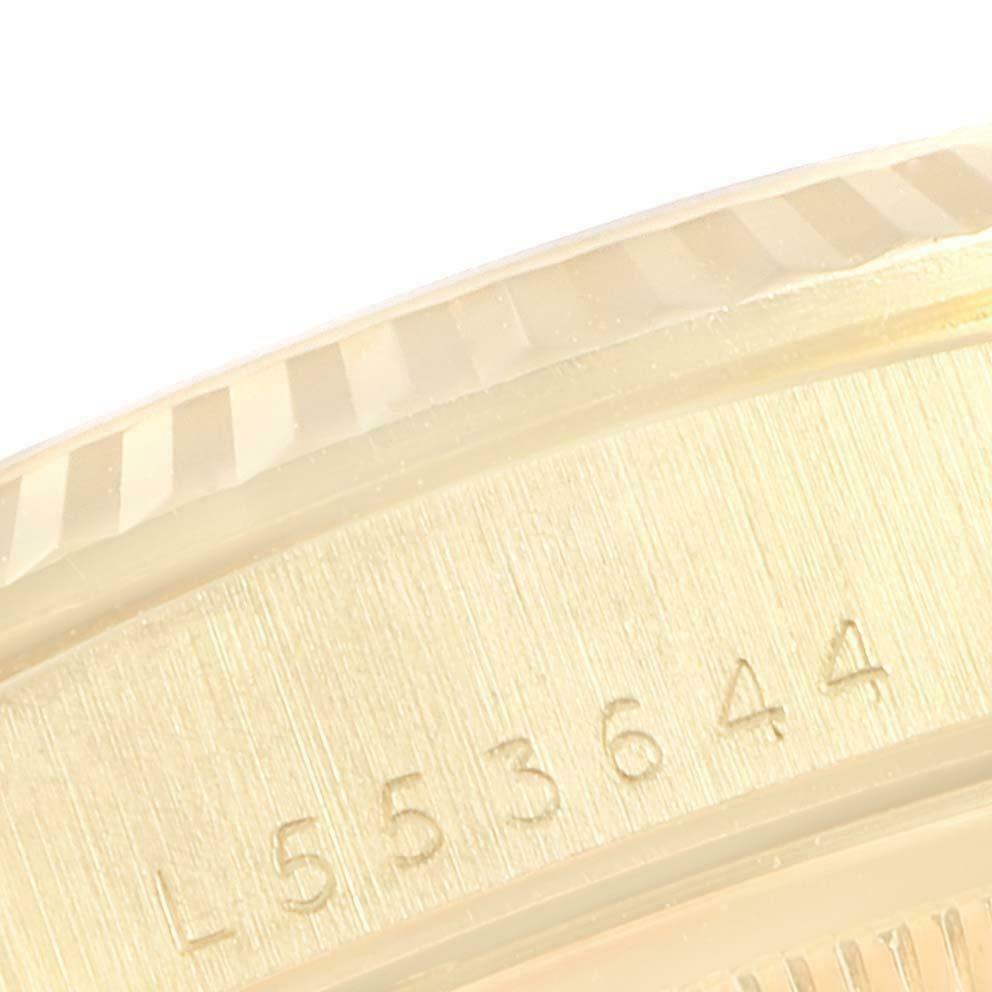 The close-up image shows the side of the Rolex President 18238 Men
s Yellow Gold Champagne Dial 18238 Men
s Yellow Gold Champagne Dial watch highlighting the engraved serial number.