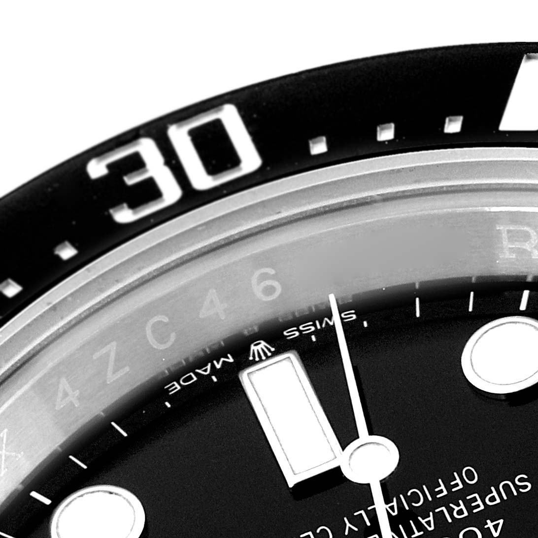 Close-up image shows the bezel, minute markers, and part of the dial of a Rolex Sea-Dweller 126600 Men
s Stainless Steel Black Dial 126600 Men
s Stainless Steel Black Dial watch.
