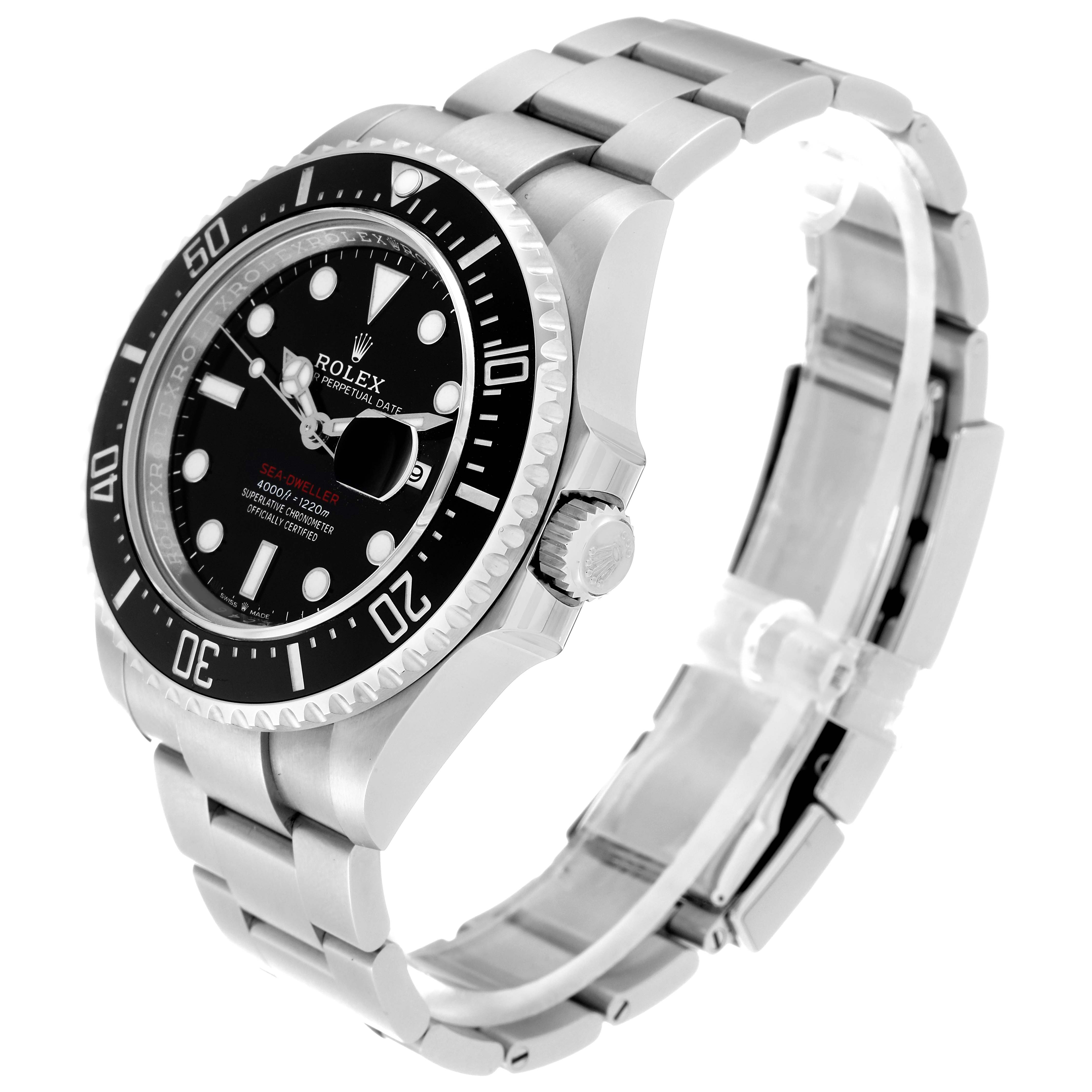 The image shows a side-angle view of the Rolex Sea-Dweller 126600 Men
s Stainless Steel Black Dial 126600 Men
s Stainless Steel Black Dial watch, highlighting the bezel, dial, crown, and bracelet.