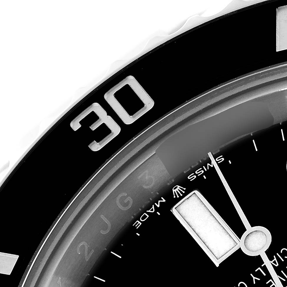 The close-up image shows part of the bezel, dial, and minute hand of a Rolex Submariner 126610 Men
s Stainless Steel Black Dial 126610 Men
s Stainless Steel Black Dial watch.