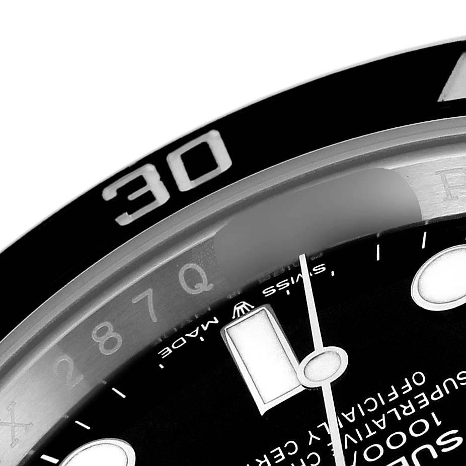 This close-up angle of the Rolex Submariner 126610 Men
s Stainless Steel Black Dial 126610 Men
s Stainless Steel Black Dial watch shows part of the dial, minute hand, and 30-minute marker on the bezel.