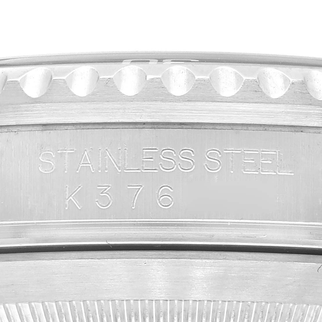 This close-up image shows the stainless steel case back with the model number and ridged edges of the Rolex Submariner 16610 Men
s Stainless Steel Black Dial 16610 Men
s Stainless Steel Black Dial watch.