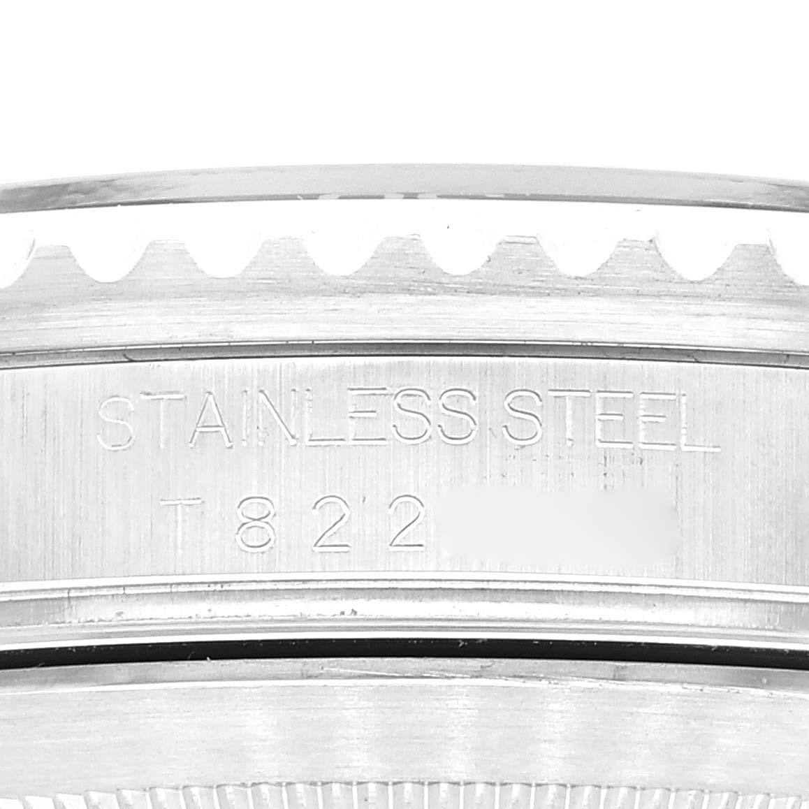 The image shows a close-up of the case back edge of a Rolex Submariner 16610 Men
s Stainless Steel Black Dial 16610 Men
s Stainless Steel Black Dial watch, focusing on the engraved text.