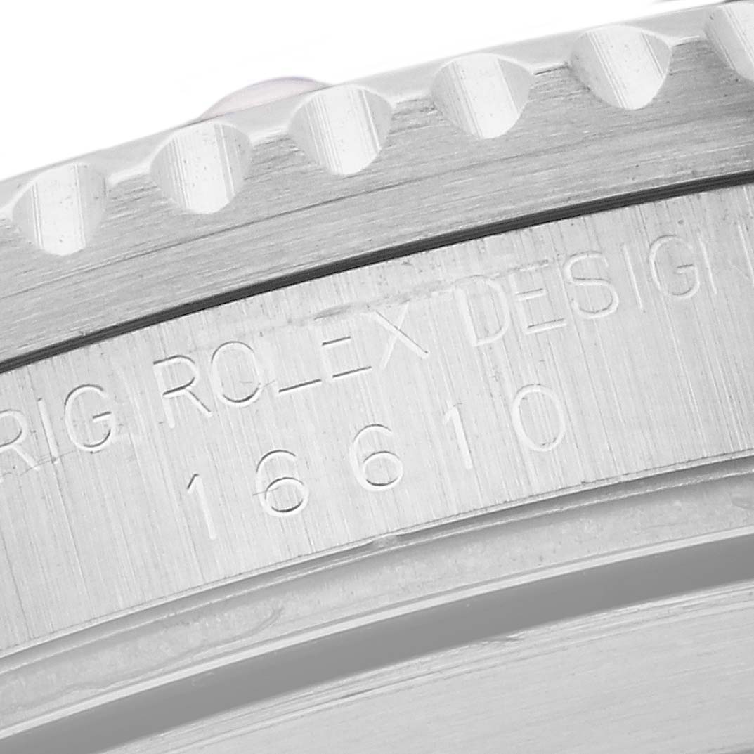 This close-up image shows the engraved details on the bezel of a Rolex Submariner 16610 Men
s Stainless Steel Black Dial 16610 Men
s Stainless Steel Black Dial model 16610.