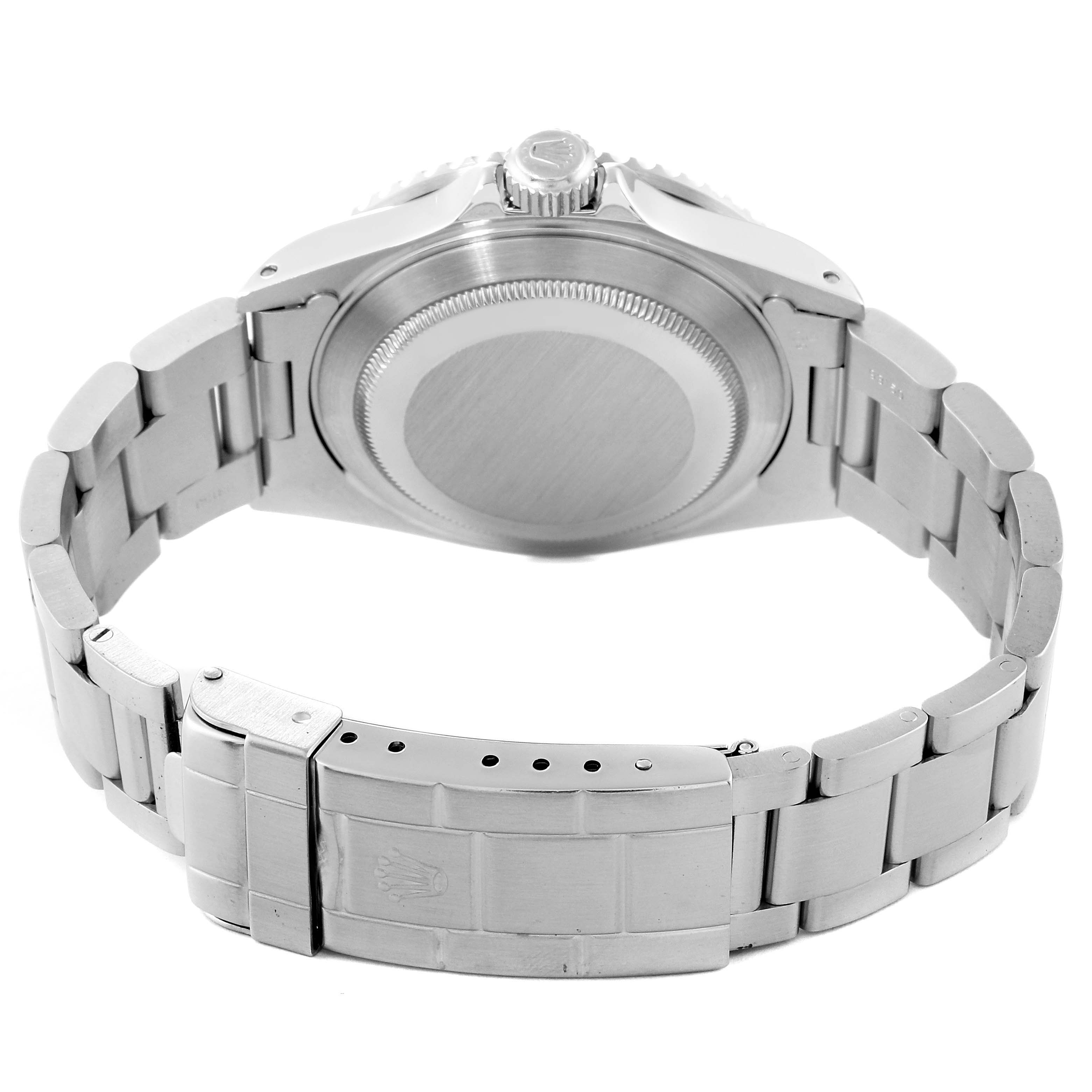 This image shows the back view of a Rolex Submariner 16610 Men
s Stainless Steel Black Dial 16610 Men
s Stainless Steel Black Dial model watch, highlighting the case back and the clasp of the bracelet.