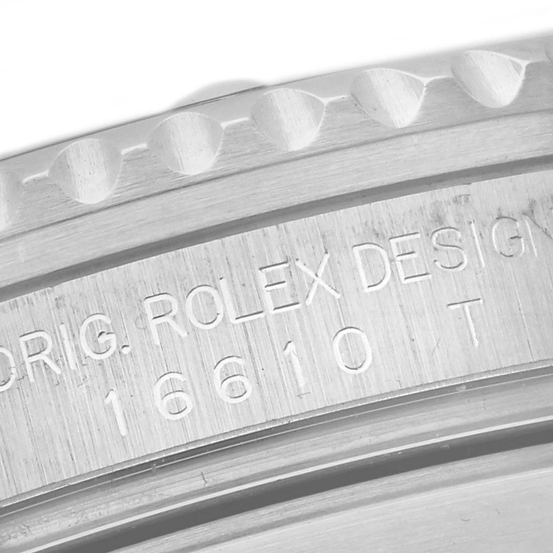This image shows a close-up of the side engraving and bezel of a Rolex Submariner 16610 Men
s Stainless Steel Black Dial 16610 Men
s Stainless Steel Black Dial watch.