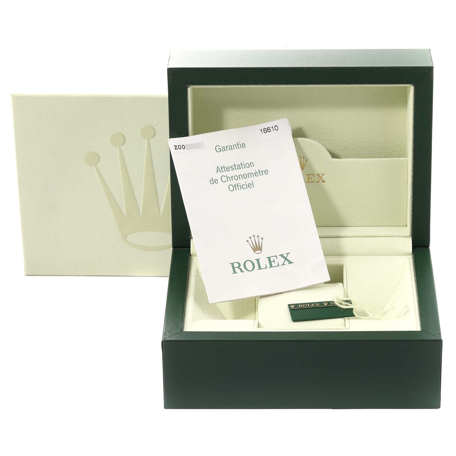 The image shows the packaging and documentation for a Rolex Submariner 16610 Men
s Stainless Steel Black Dial 16610 Men
s Stainless Steel Black Dial watch, including a green box and an official chronometer certificate.