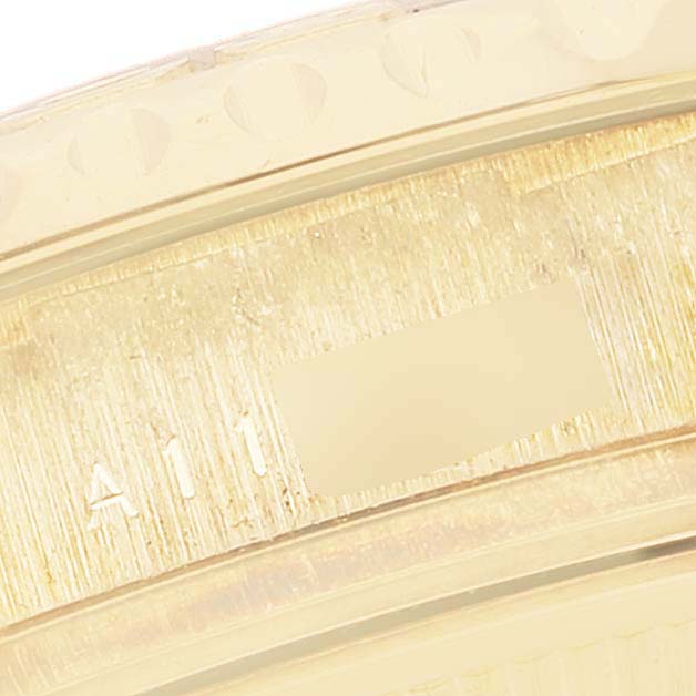 The image shows a close-up view of the Rolex Yacht-Master 169628 Women's Yellow Gold Mother of Pearl Dial 169628 Women's Yellow Gold Mother of Pearl Dial watch case, focusing on the engraved serial number area.