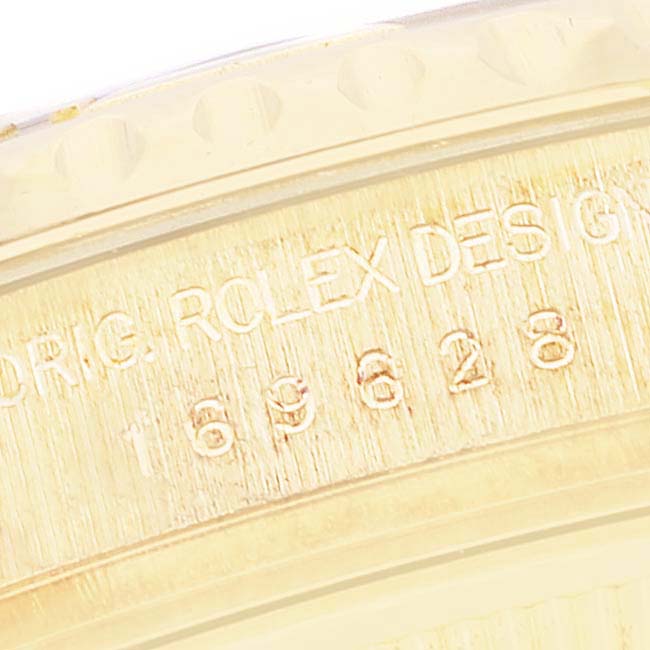 This is a close-up of the engraved details on the case side of a Rolex Yacht-Master 169628 Women's Yellow Gold Mother of Pearl Dial 169628 Women's Yellow Gold Mother of Pearl Dial watch.