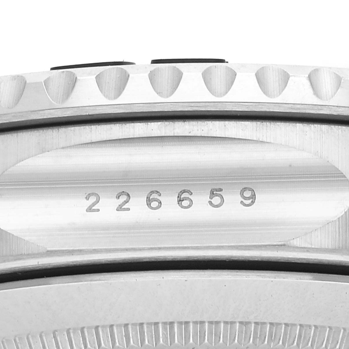The image shows a close-up of the case side of a Rolex Yacht-Master 226659 Men's White Gold Black Dial 226659 Men's White Gold Black Dial watch, focusing on the serial number engraved between the lugs.