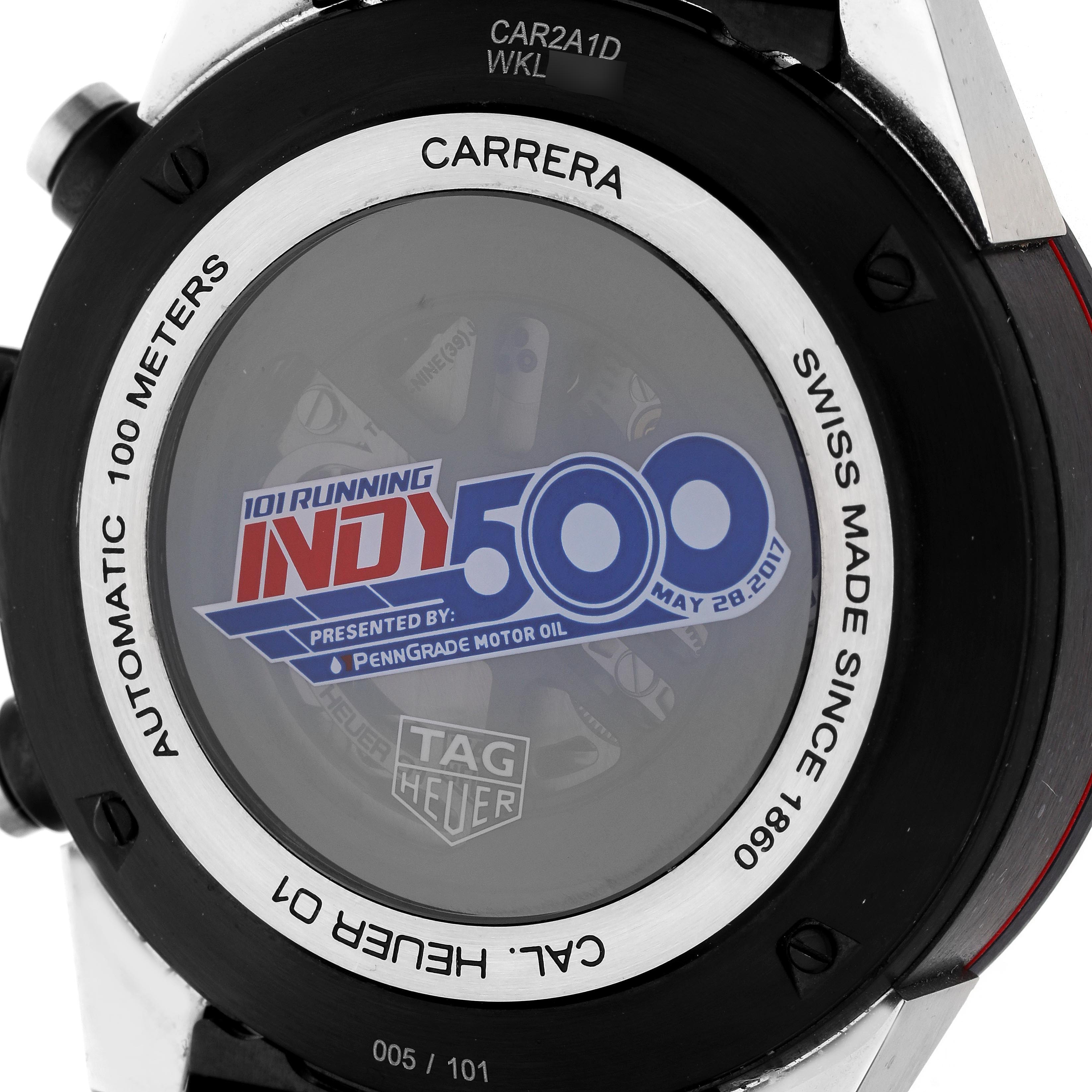 The image shows the back of the Tag Heuer Carrera CAR2A1D.FT6101 Men
s Titanium Grey Dial CAR2A1D.FT6101 Men
s Titanium Grey Dial watch featuring an Indy 500 design and automatic movement details.