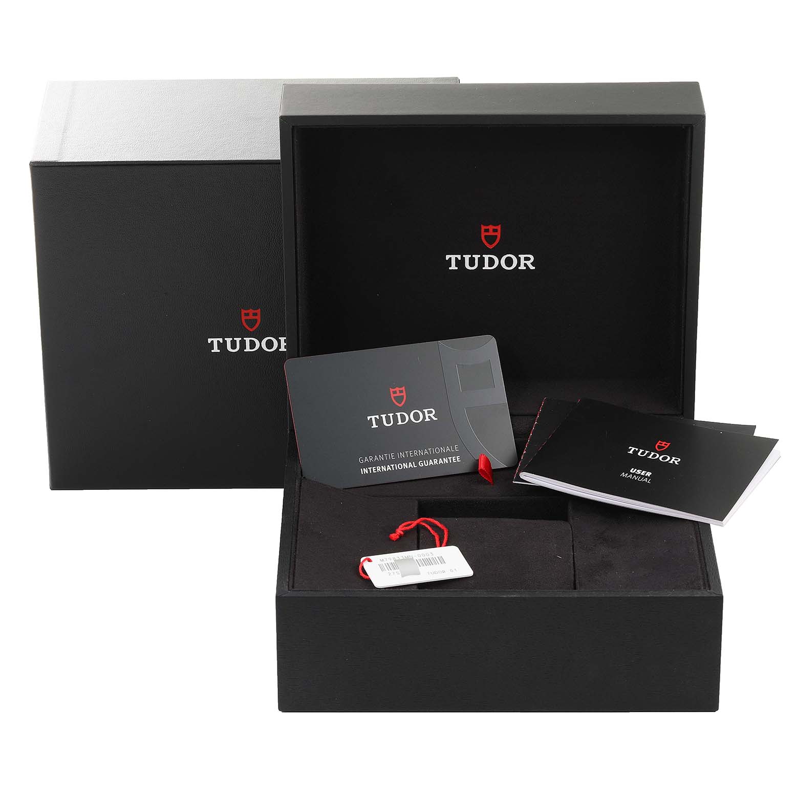 The image shows the packaging and accessories for the Tudor Heritage Black Bay 79833MN Men's Stainless Steel Black Dial 79833MN Men's Stainless Steel Black Dial watch, including the box, manual, and warranty card.