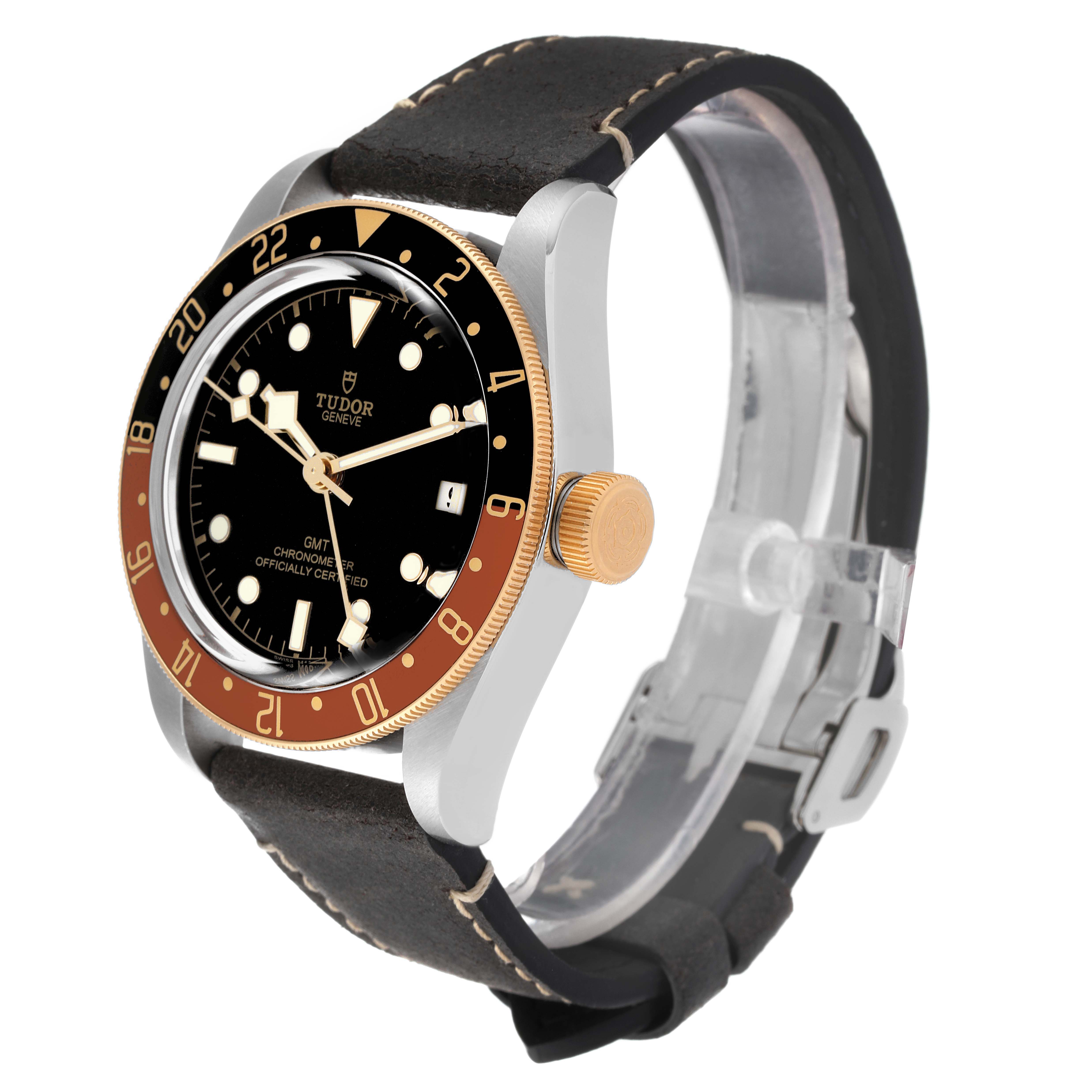 The Tudor Heritage Black Bay 79833MN Men's Stainless Steel Black Dial 79833MN Men's Stainless Steel Black Dial watch is shown at a side angle, featuring its dial, bezel, case, crown, and leather strap.