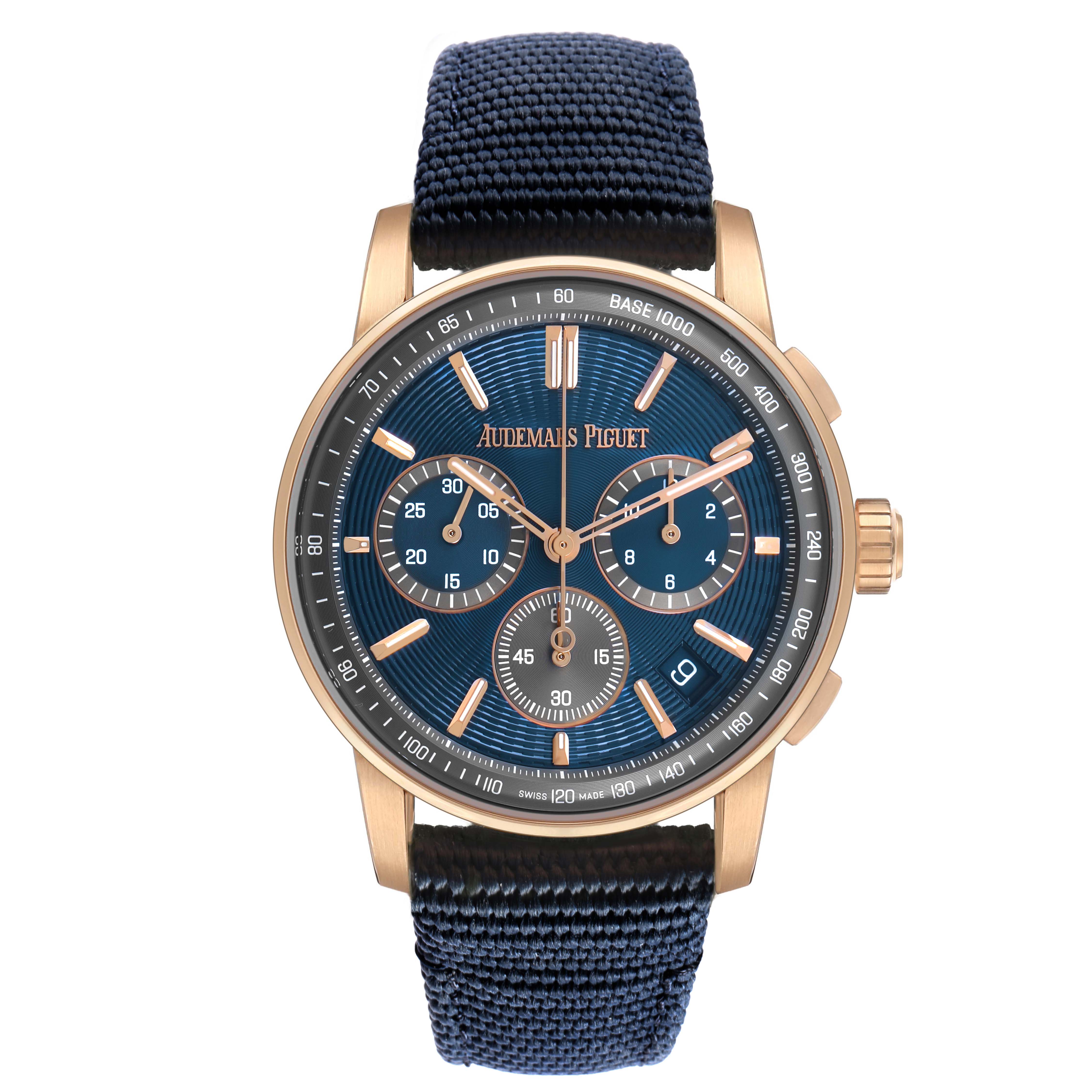 The Audemars Piguet Code 11.59 26393OR Men's Rose Gold Blue Dial watch is shown from a front angle, highlighting the dial, gold case, and blue strap.