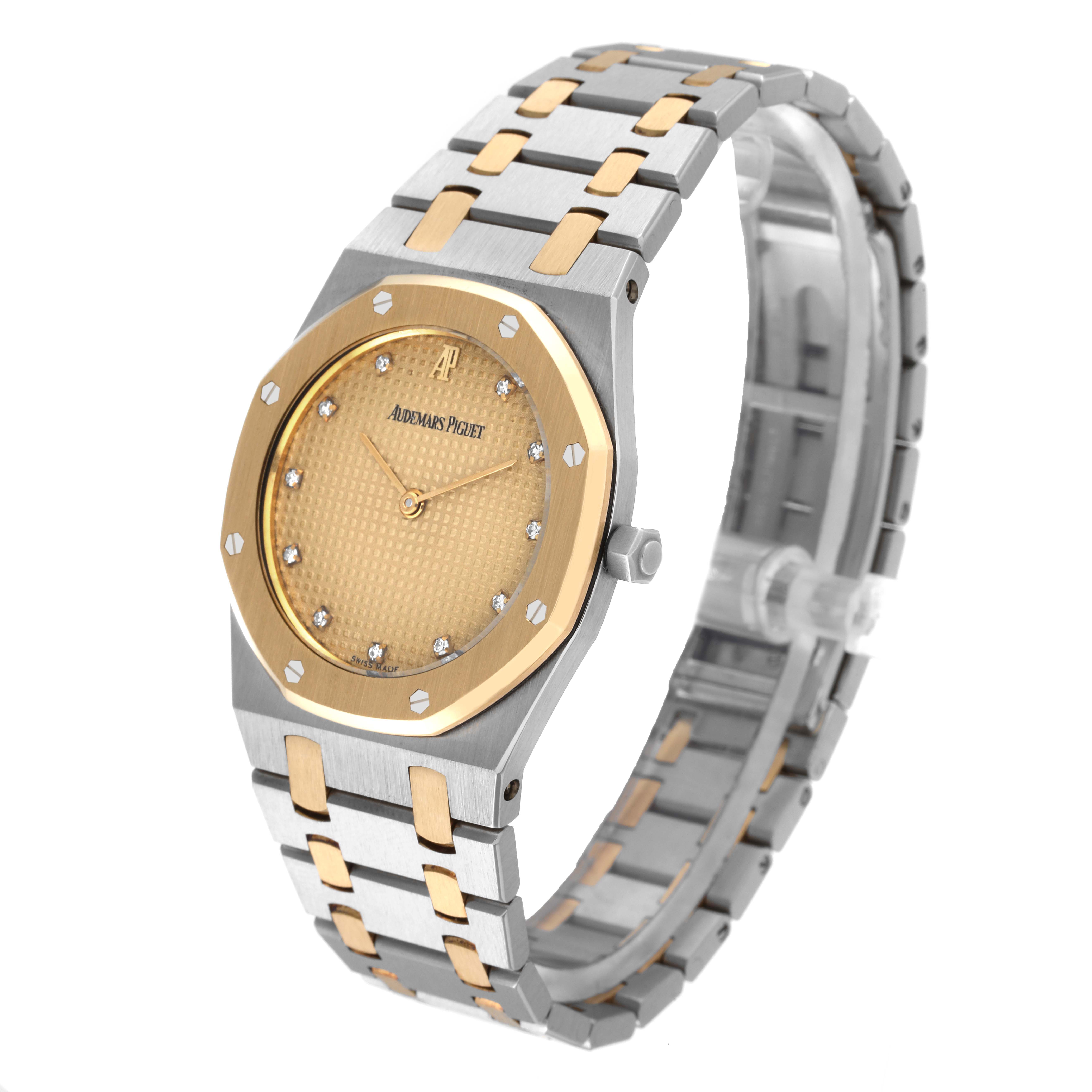 The image shows a three-quarter view of the Audemars Piguet Royal Oak 56303SA Men's Steel and Gold (two tone) Champagne Dial 56303SA Men's Steel and Gold (two tone) Champagne Dial watch, displaying its face, bracelet, and bezel.