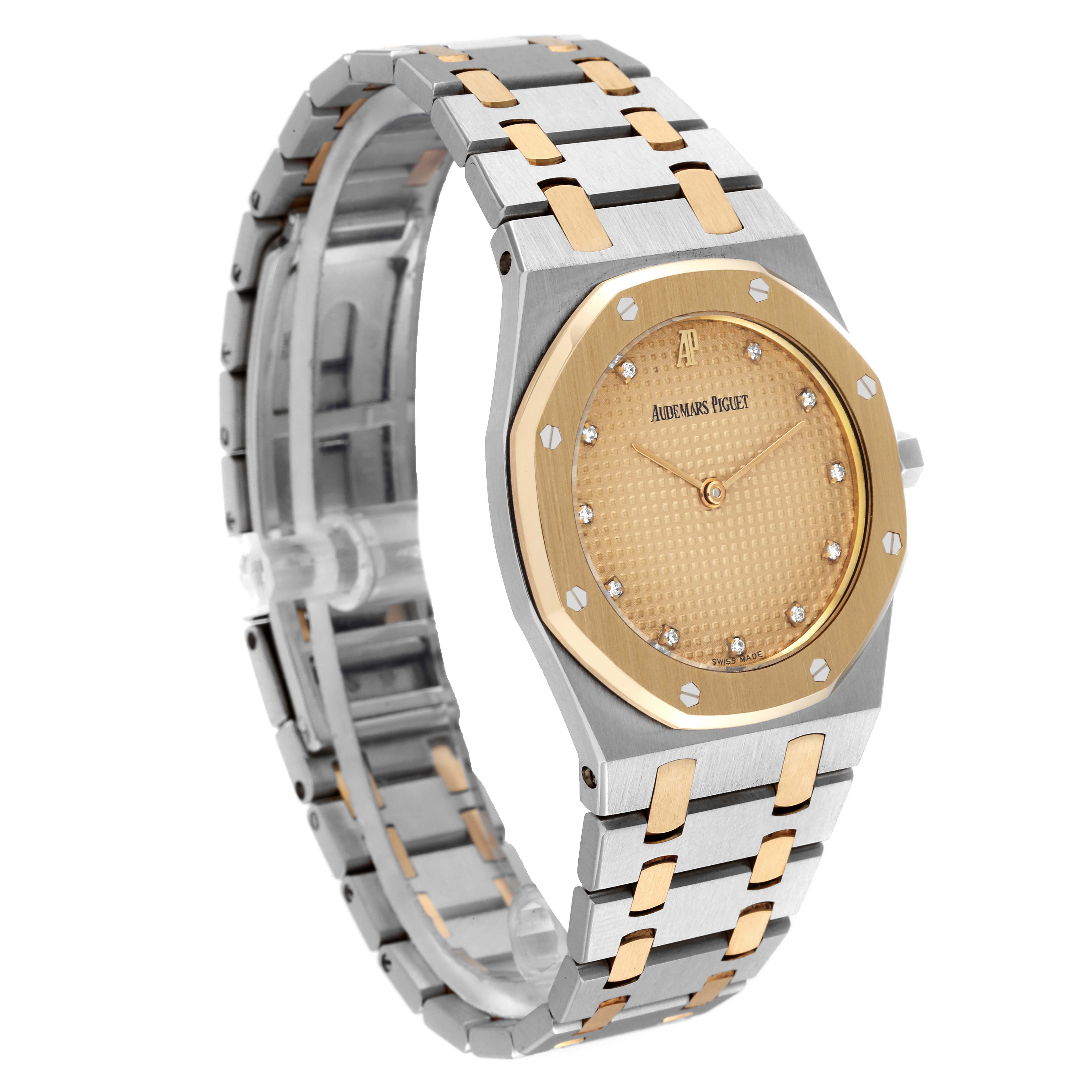 This image shows the Audemars Piguet Royal Oak 56303SA Men's Steel and Gold (two tone) Champagne Dial 56303SA Men's Steel and Gold (two tone) Champagne Dial watch at a three-quarter angle, highlighting its dial, bezel, and bracelet.