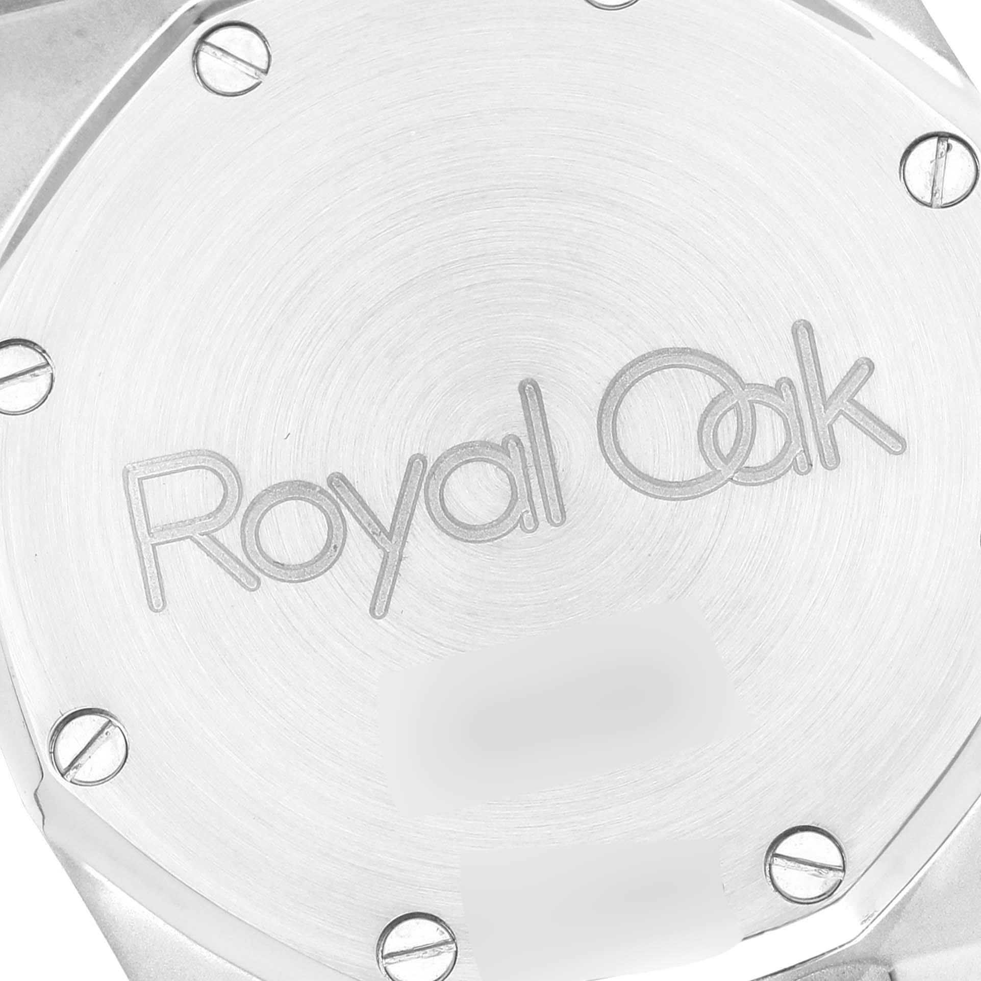 This image shows the case back of a Royal Oak watch by Audemars Piguet at an angled close-up.