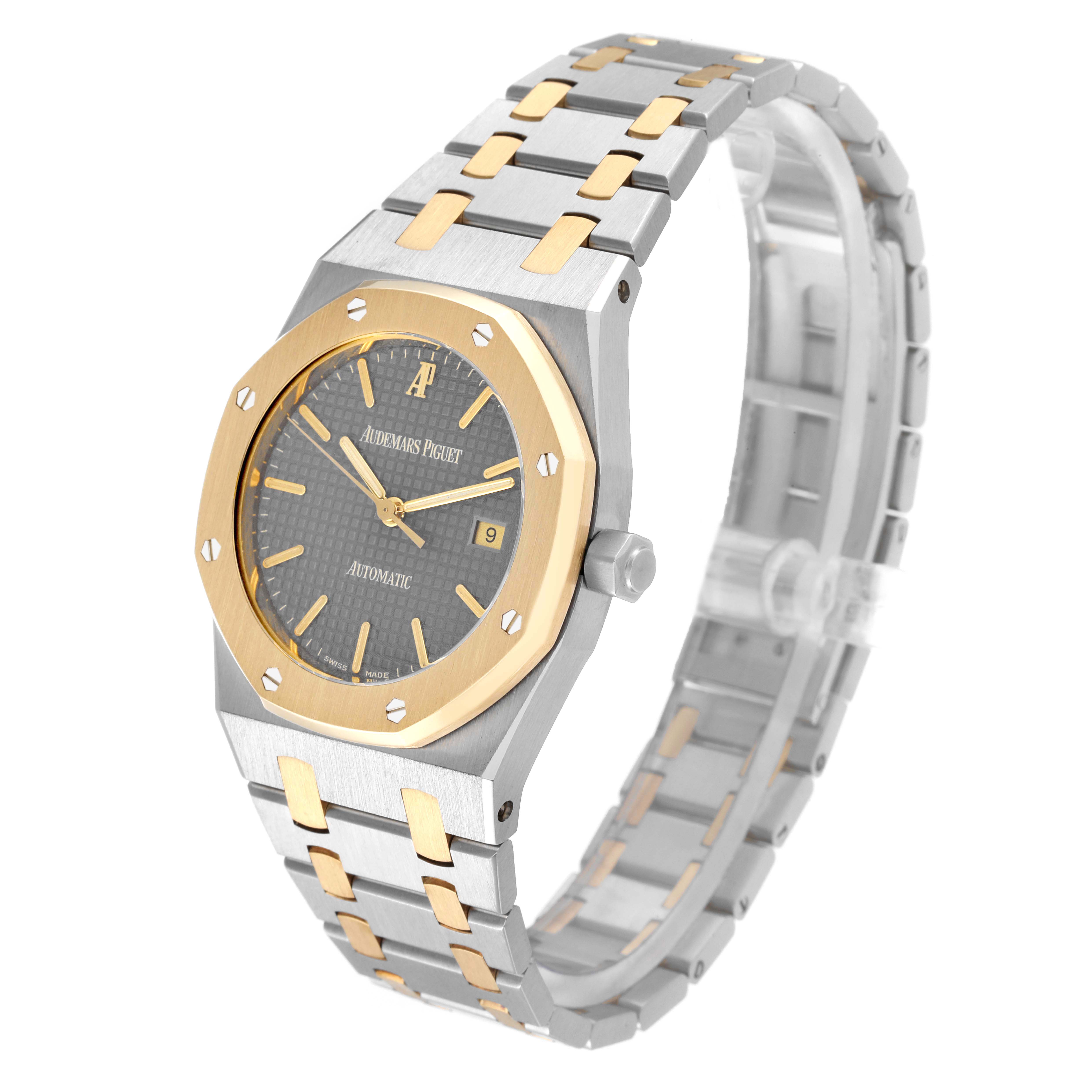 The image shows a side angle of the Audemars Piguet Royal Oak 15000SA Men's Steel and Gold (two tone) Grey Dial 15000SA Men's Steel and Gold (two tone) Grey Dial watch, focusing on its case, bezel, dial, and bracelet.