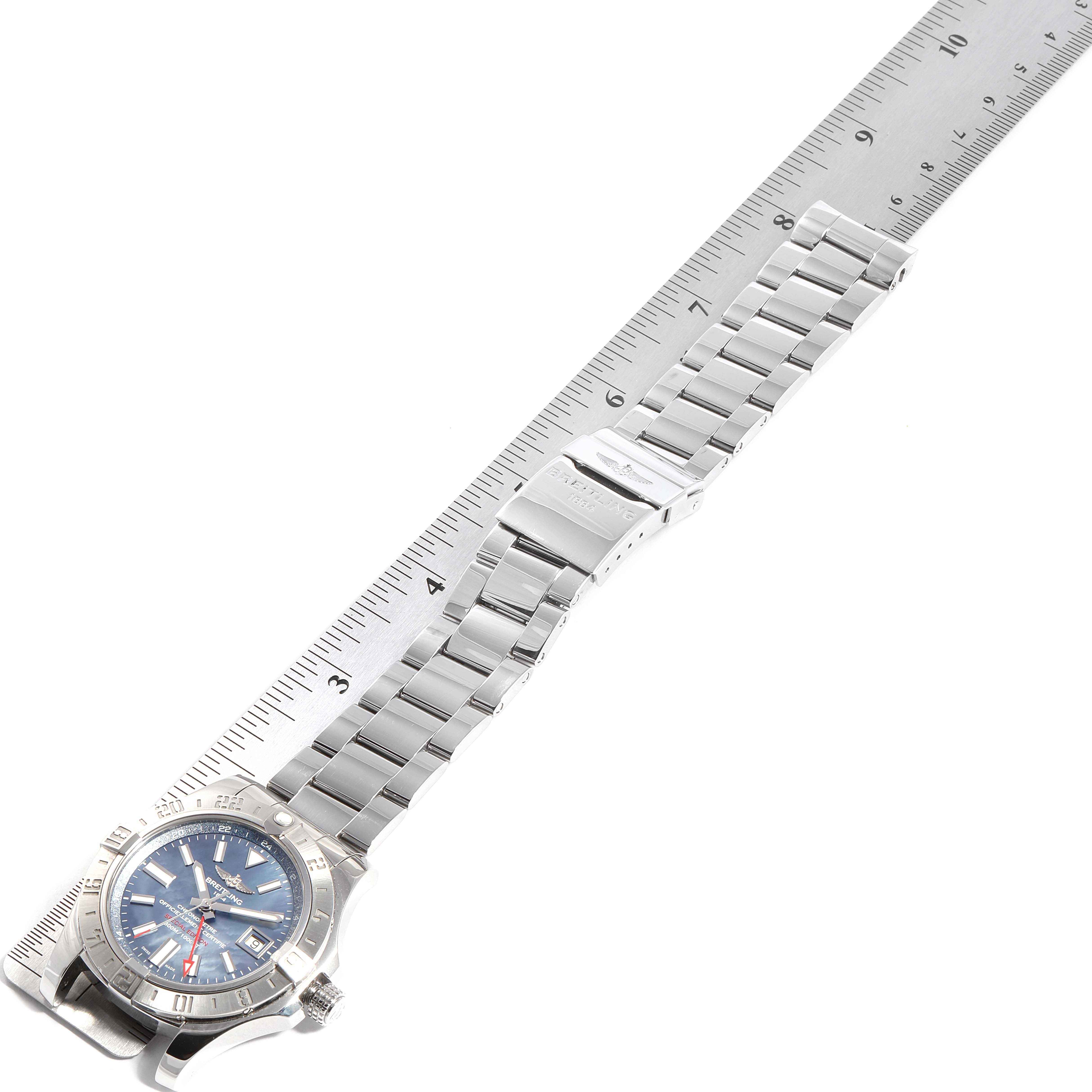 The image shows a top view of a Breitling Avenger A32390 Men's Stainless Steel Blue Dial A32390 Men's Stainless Steel Blue Dial watch with a full stainless steel bracelet placed next to a ruler.