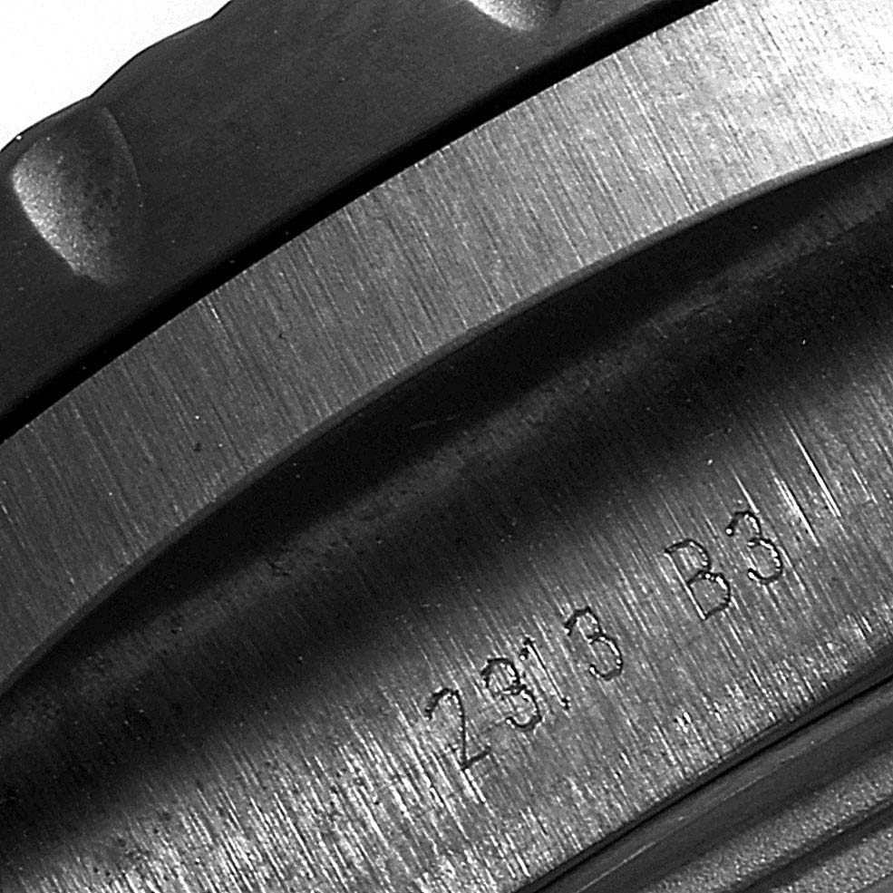 This close-up image shows the bezel edge and part of the engraved inner case of a Bentley model by Breitling.