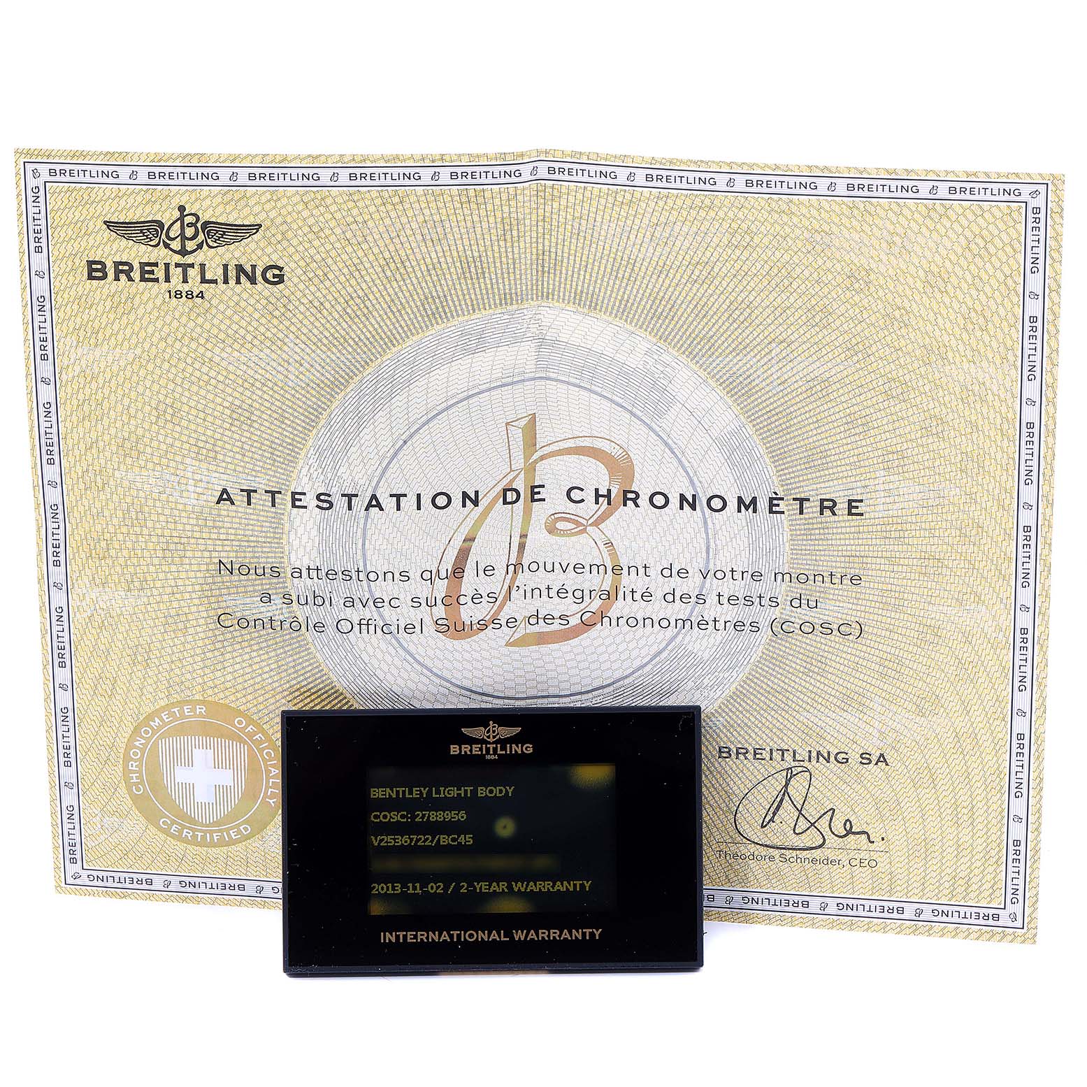 The image shows the warranty card and attestation of chronometer certificate for the Bentley model by Breitling.
