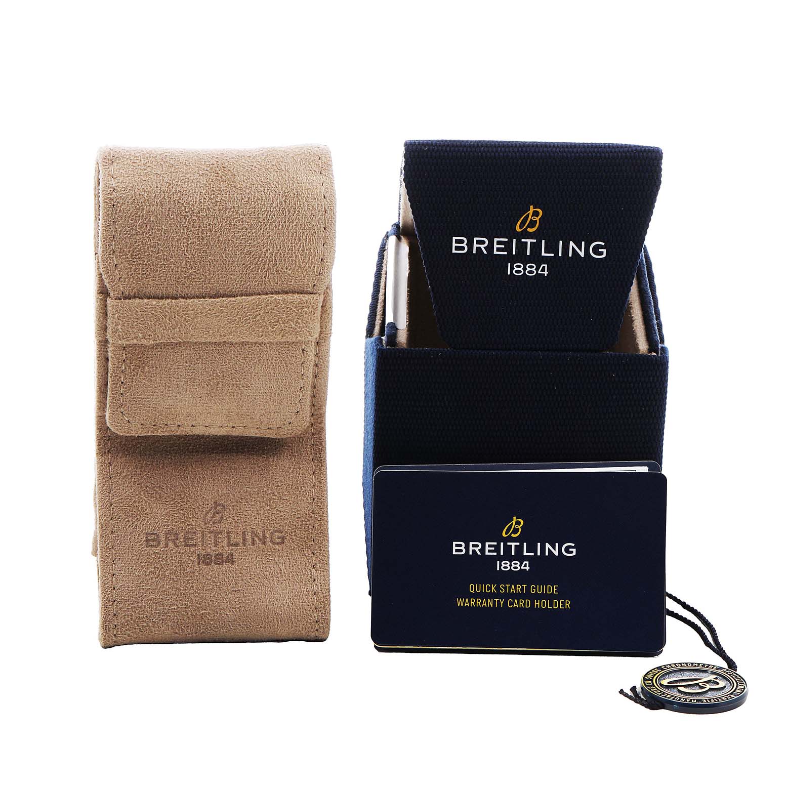 The image shows a Navitimer by Breitling accessory set with a suede travel pouch and branded packaging, viewed from the front.