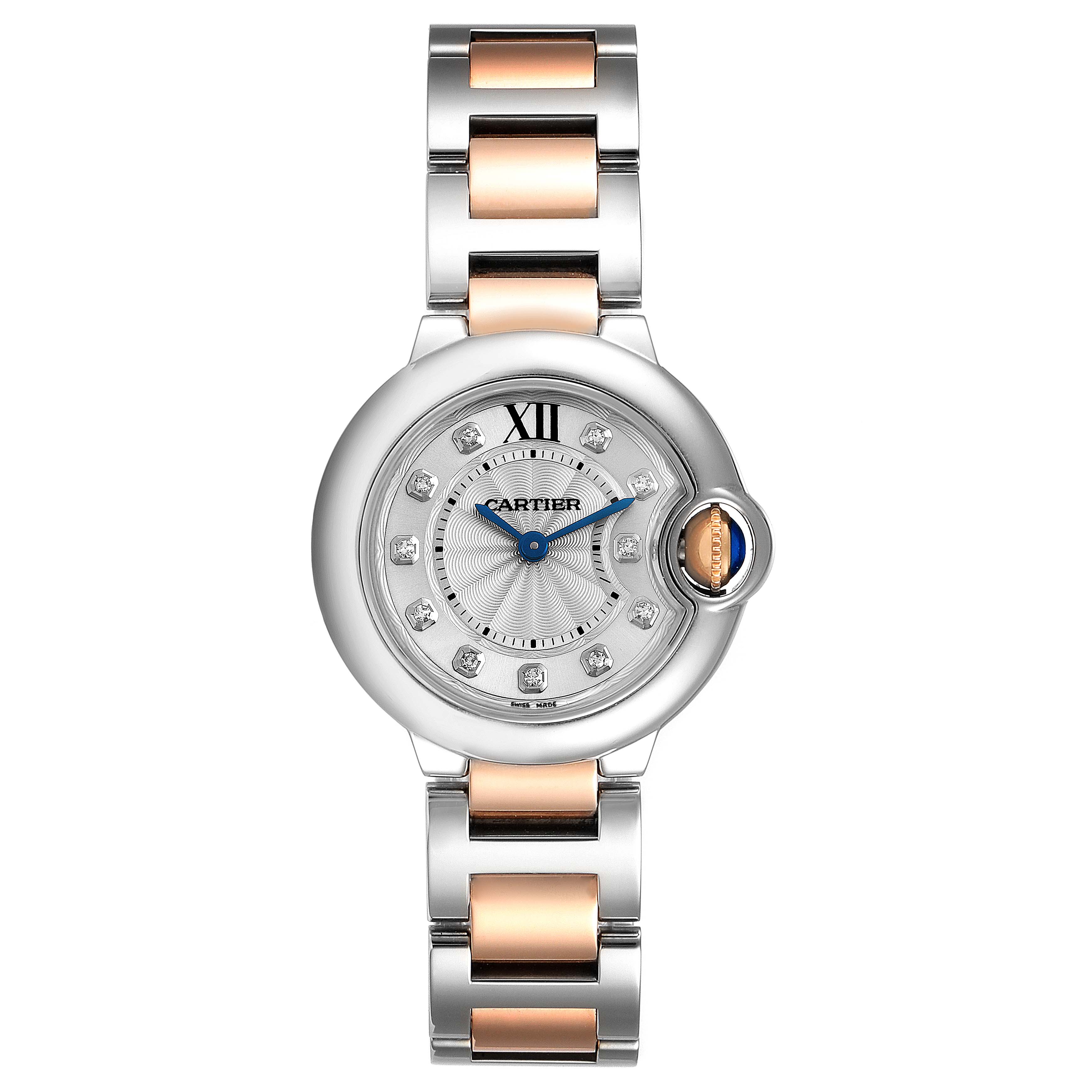 The Cartier Ballon Bleu WE902030 Women
s Steel and Gold (two tone) Silver Dial WE902030 Women
s Steel and Gold (two tone) Silver Dial watch is shown from a top-down angle, displaying its round face, metal bracelet, and signature crown.