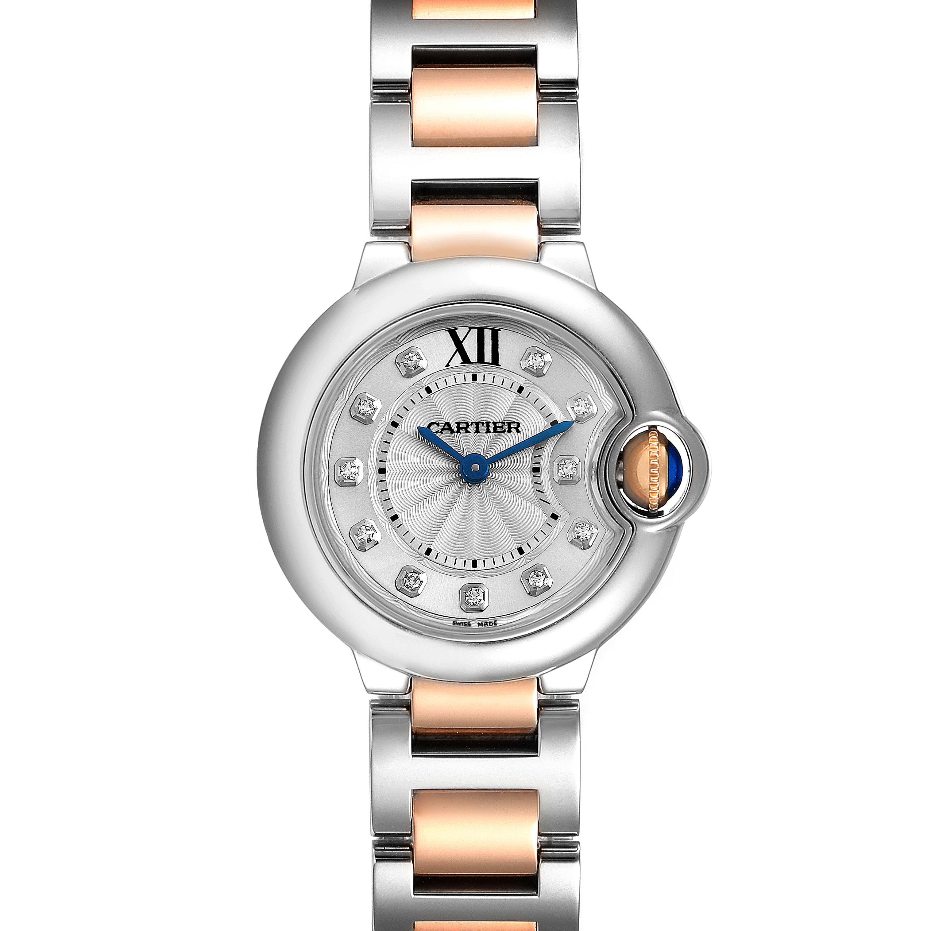 The image shows a top view of a Cartier Ballon Bleu WE902030 Women
s Steel and Gold (two tone) Silver Dial WE902030 Women
s Steel and Gold (two tone) Silver Dial watch, highlighting its face, bezel, crown, and part of the bracelet.