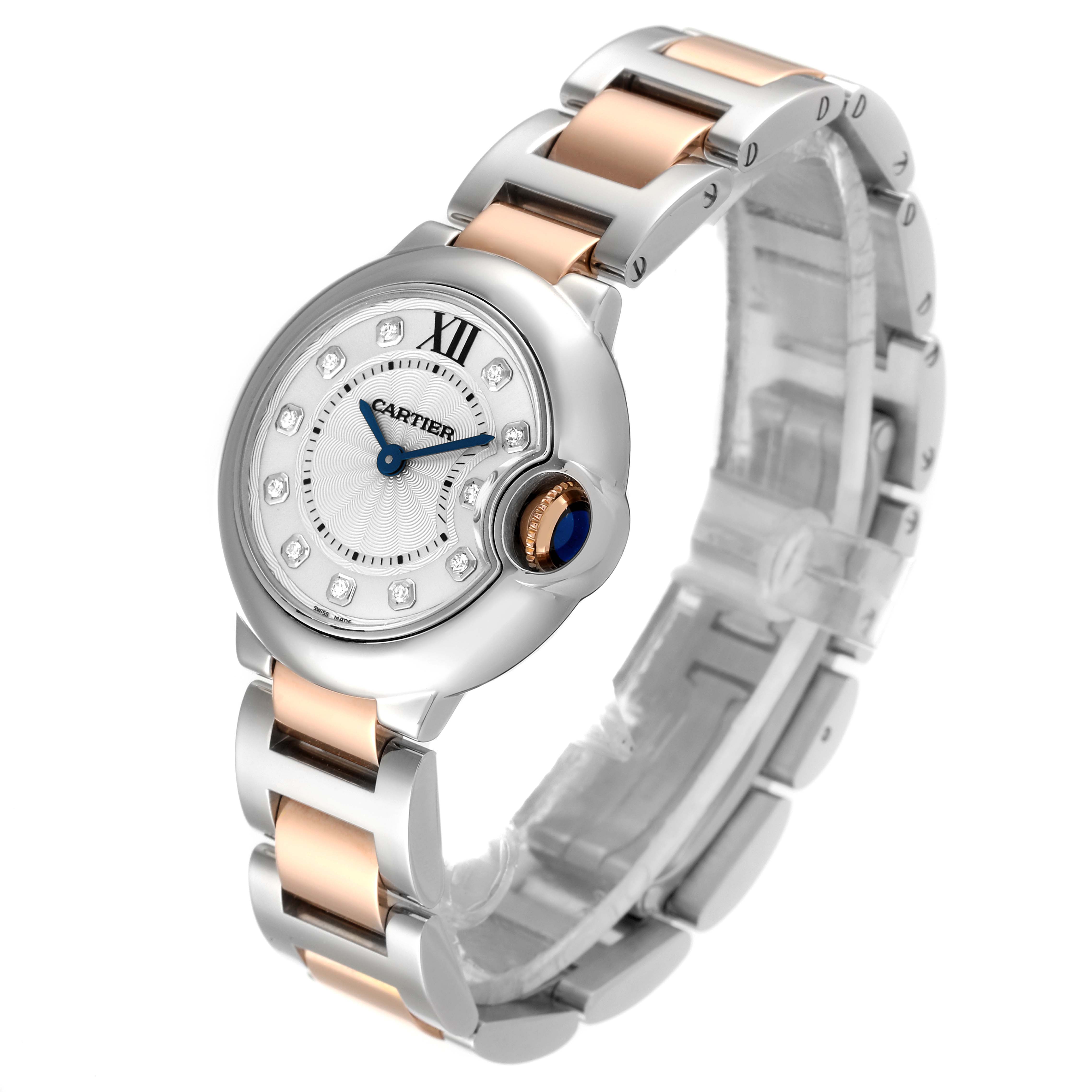 This image shows a Cartier Ballon Bleu WE902030 Women
s Steel and Gold (two tone) Silver Dial WE902030 Women
s Steel and Gold (two tone) Silver Dial watch at a three-quarter angle, highlighting the face, bezel, and two-tone bracelet.