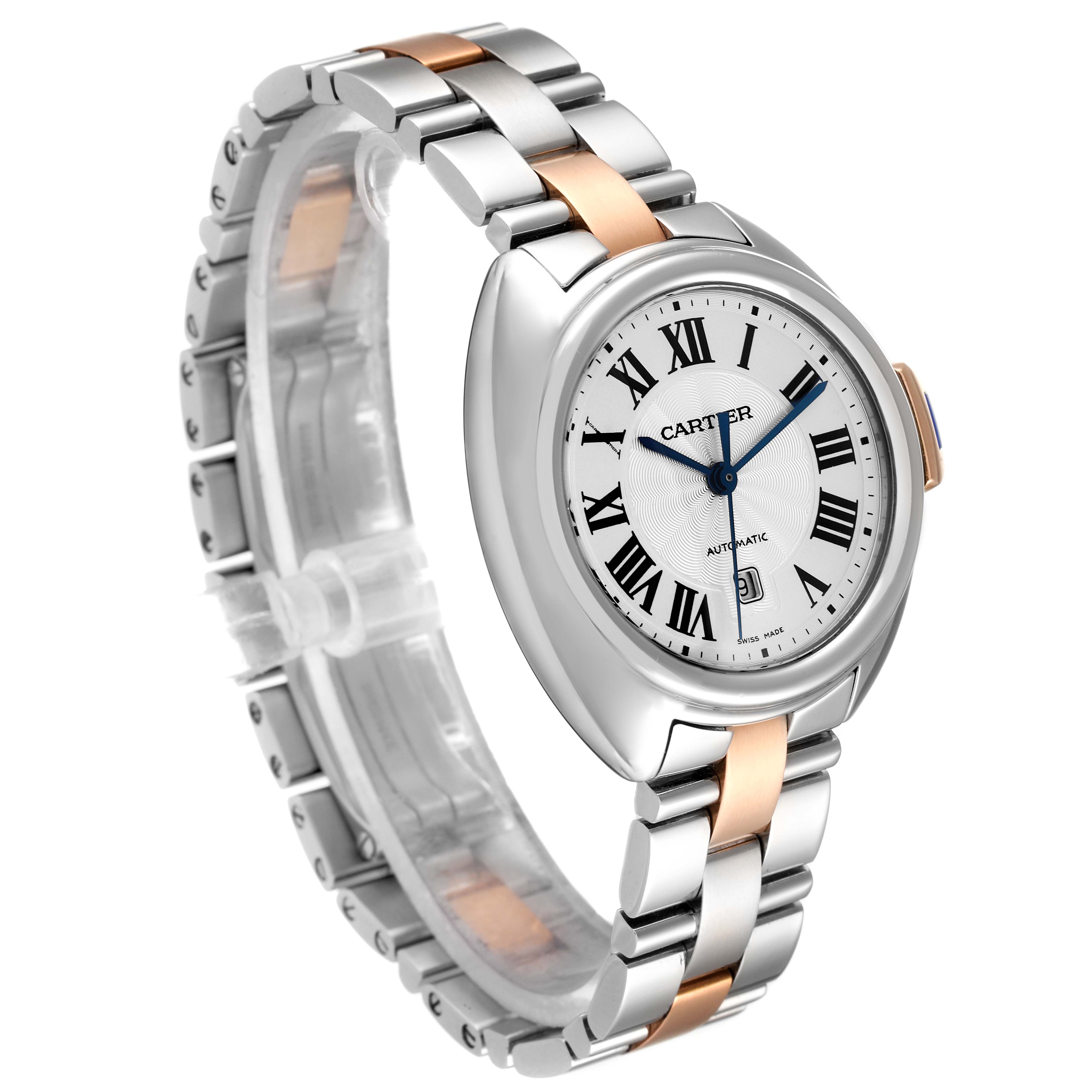 The Cartier Clé watch is shown at a slight angle, highlighting its face, bezel, and bracelet.