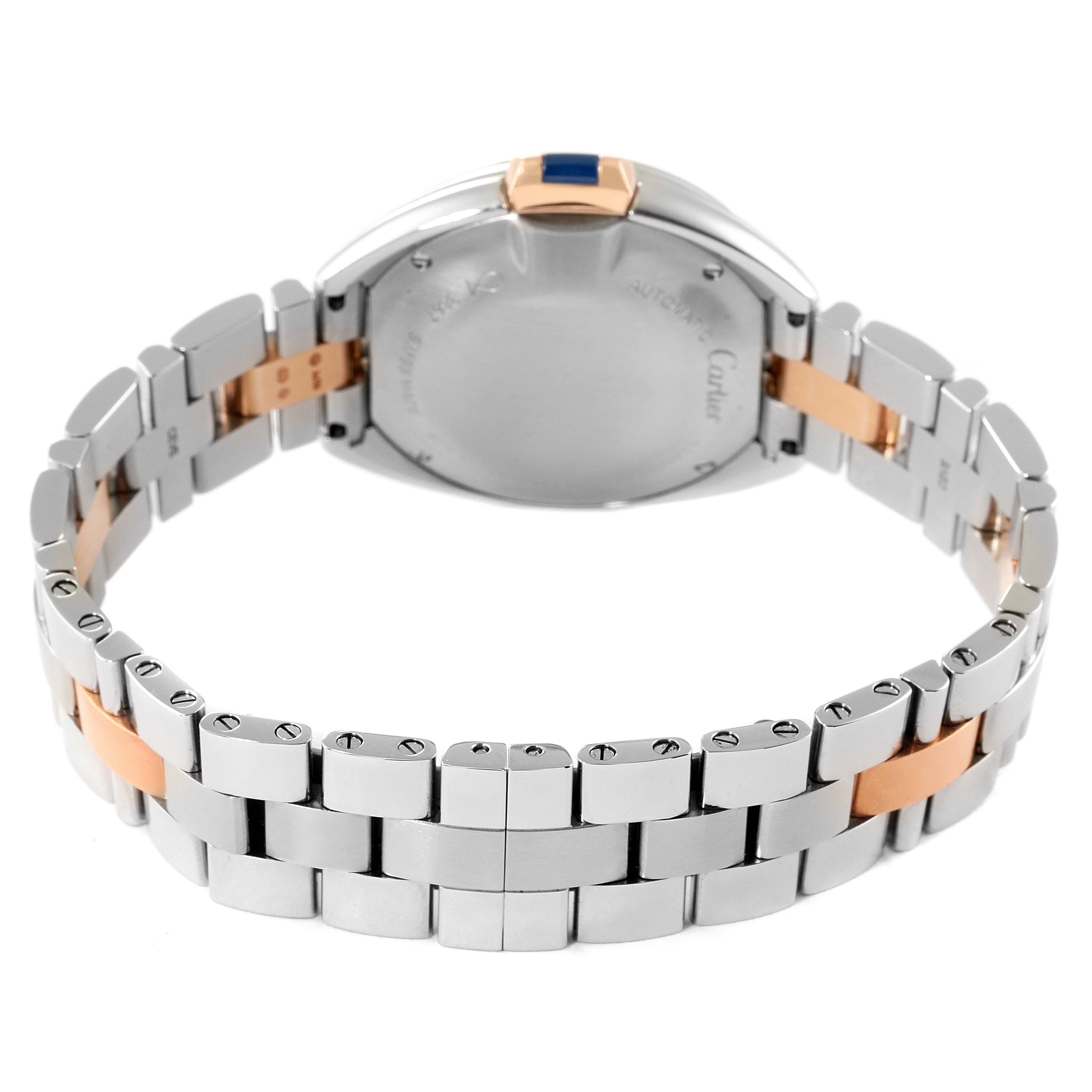 This image shows the back of the Cle model watch by Cartier, highlighting the case back and the metal bracelet.