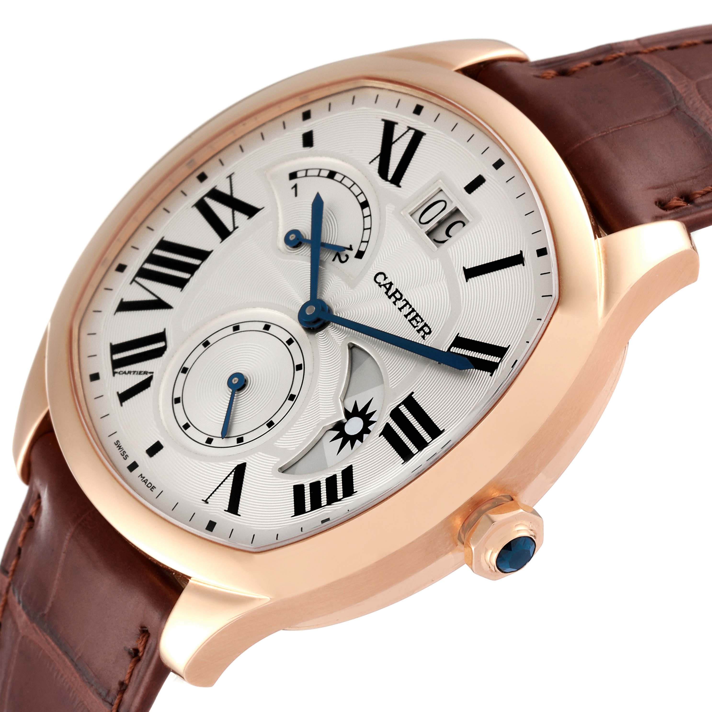 The image shows a Drive de Cartier watch by Cartier angled to display the dial, crown, and brown leather strap.