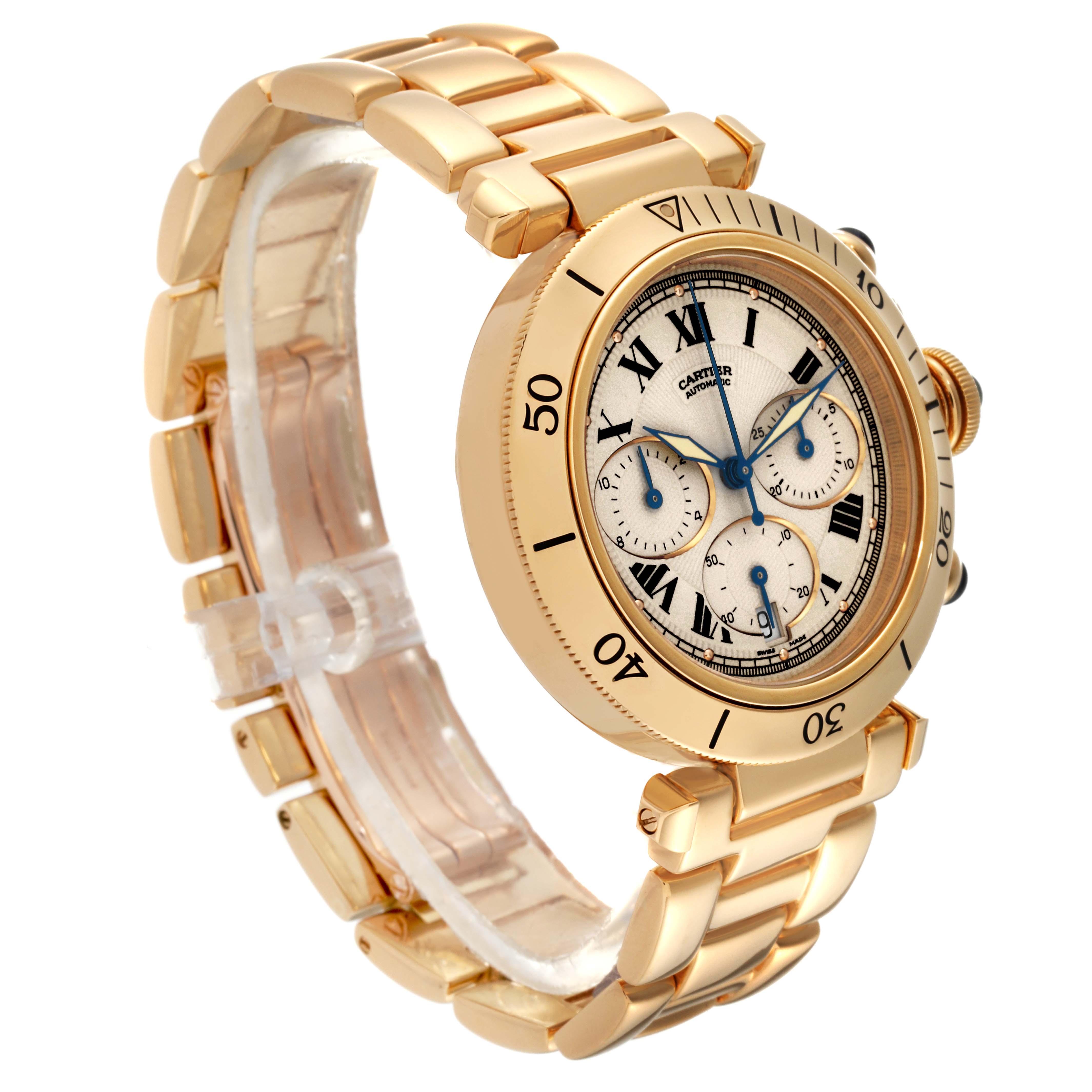 The image shows a Cartier Pasha W524428 Men
s Yellow Gold Silver Dial W524428 Men
s Yellow Gold Silver Dial model watch from a left-side angle, featuring its gold bracelet, bezel, and detailed dial.