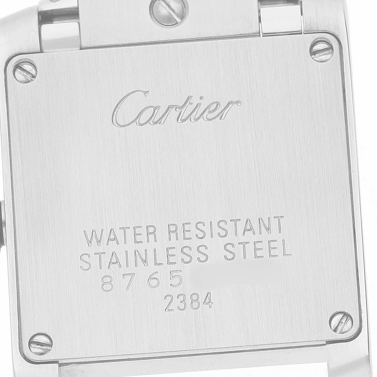 The image shows the back case of a Cartier Tank Francaise W51028Q3 Women's Stainless Steel Mother of Pearl Dial watch, highlighting the engraved branding and specifications.