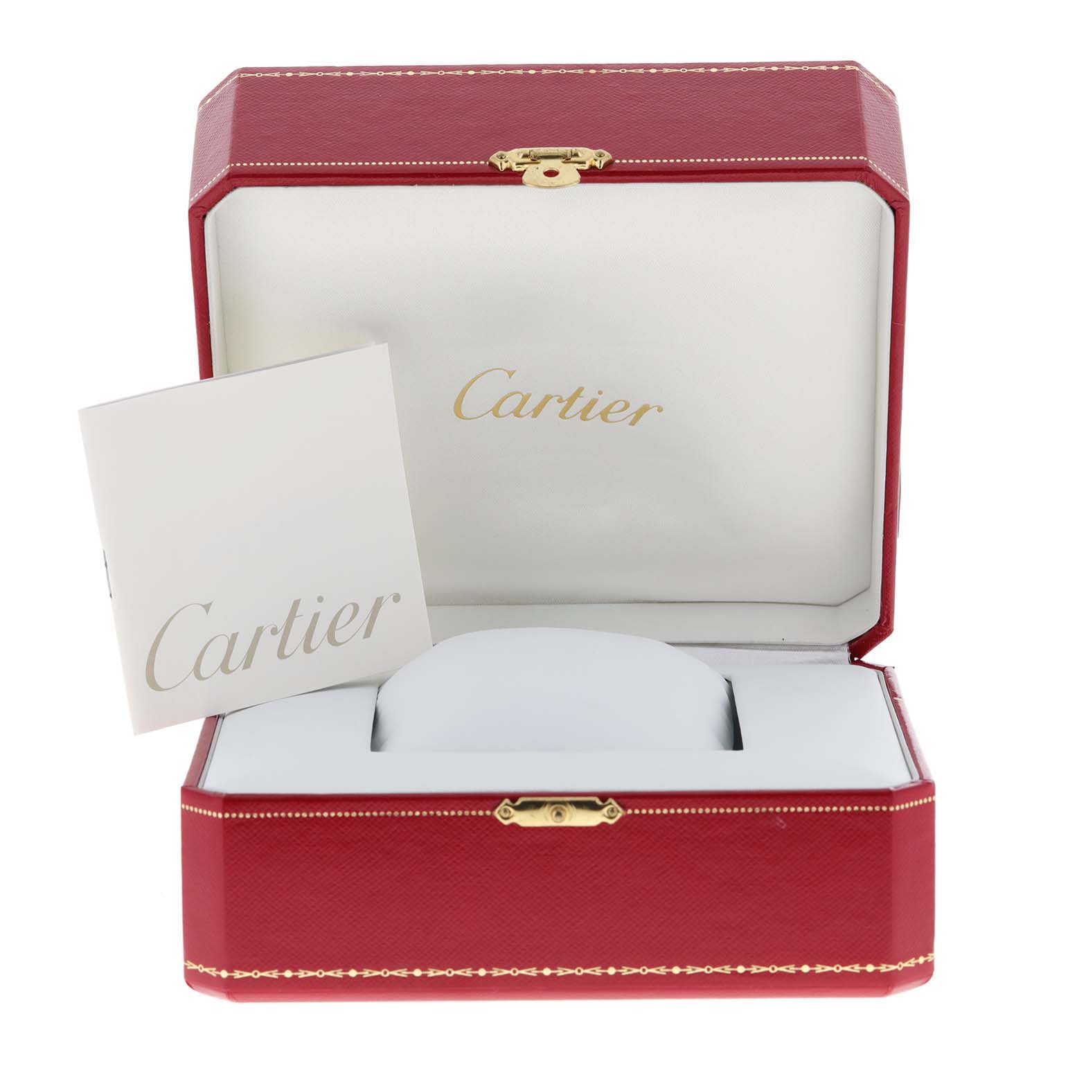 The image shows an open Cartier watch box and booklet, designed for the Tank Solo model.