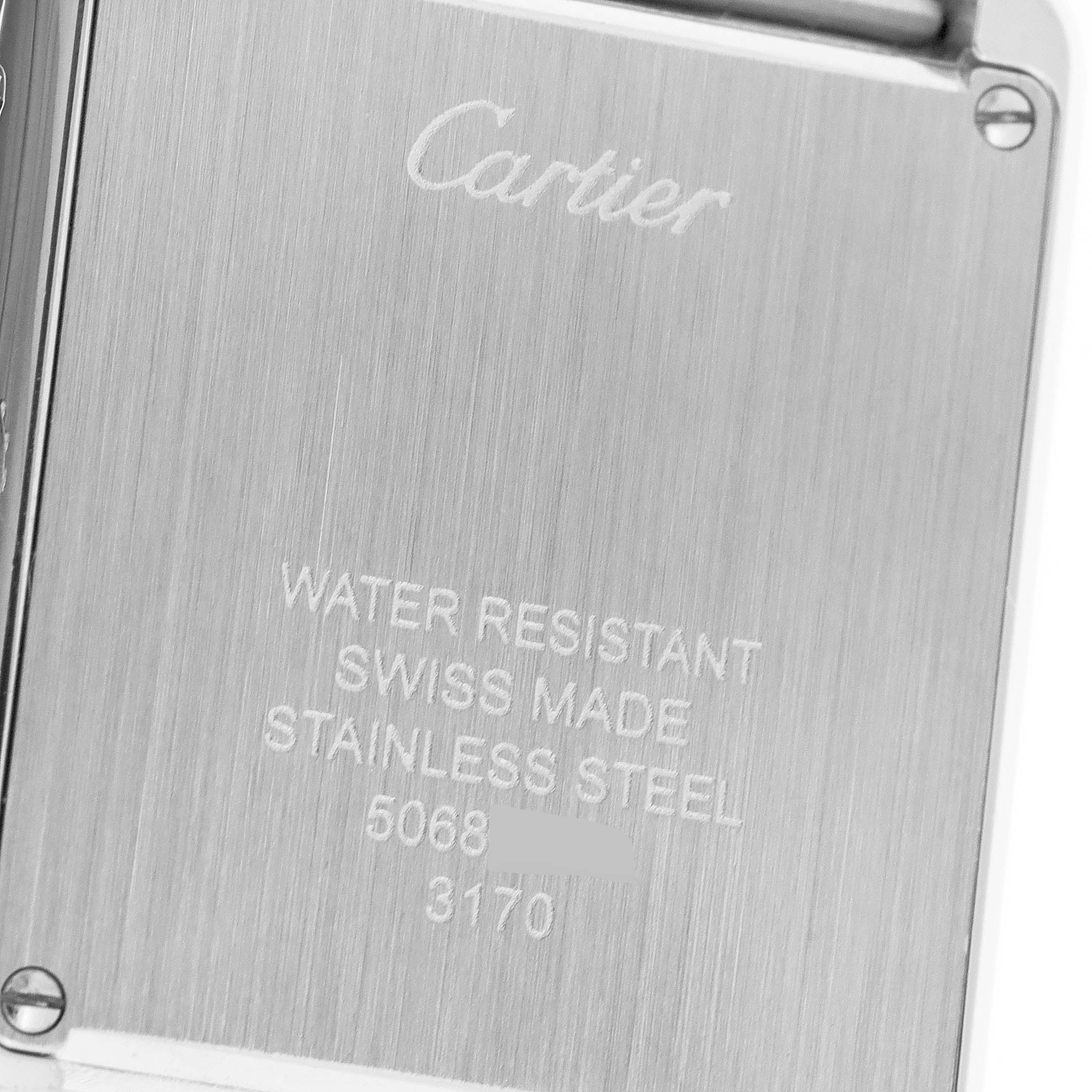 This image shows the back case of a Cartier Tank Solo W5200013 Women's Stainless Steel Silver Dial W5200013 Women's Stainless Steel Silver Dial watch, highlighting the engravings and screws.