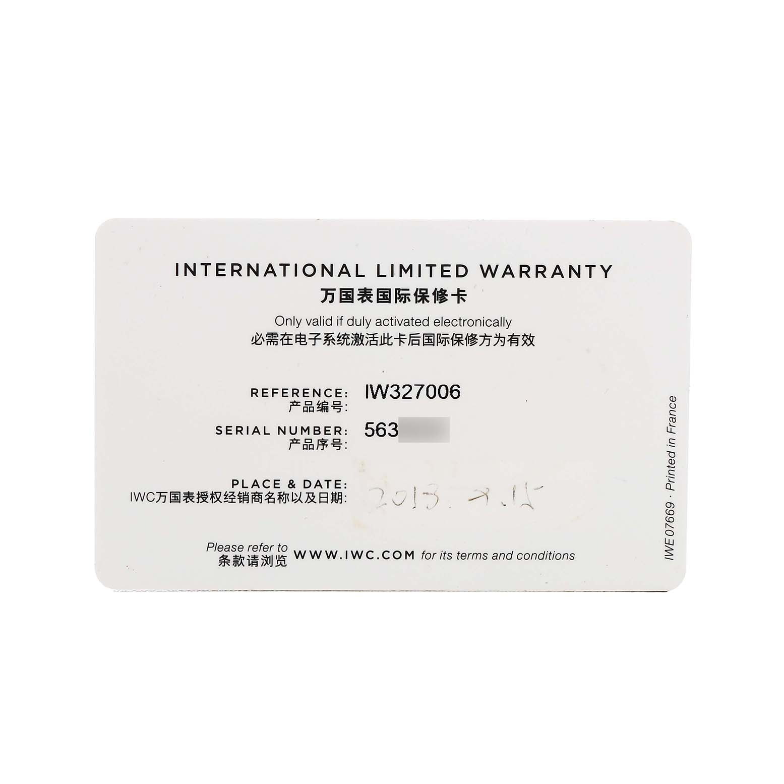 The image shows an IWC Pilot IW327006 Men's Titanium Black Dial model's International Limited Warranty card with model and serial numbers visible.