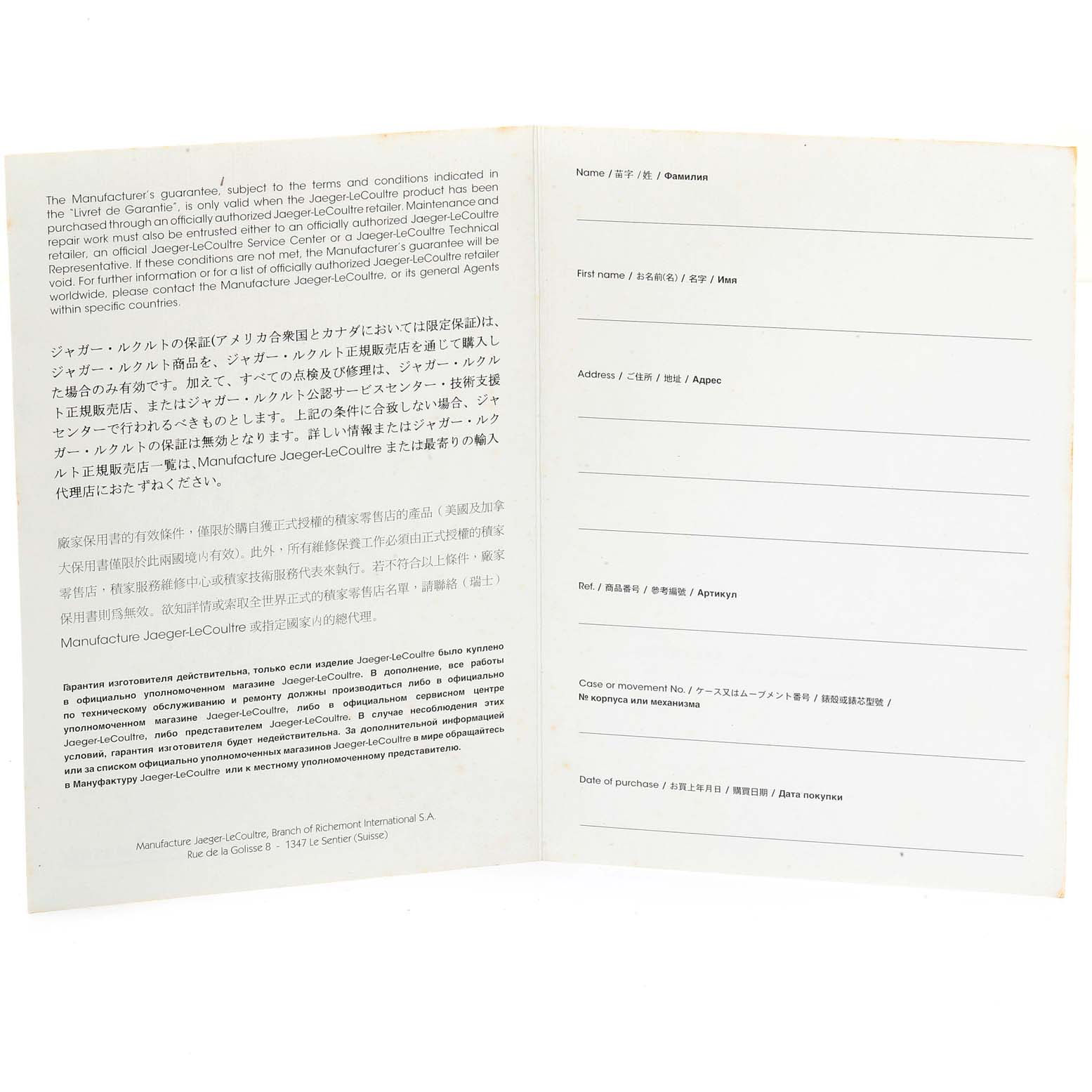 The image shows an open guarantee booklet for the Jaeger-LeCoultre Reverso watch, displaying warranty terms and personal details sections.