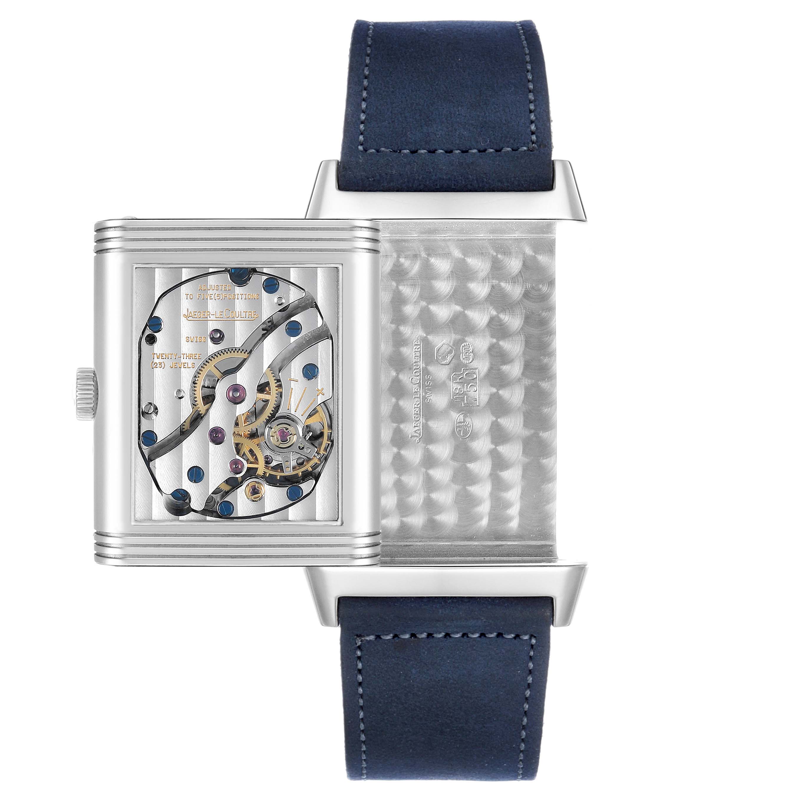 The Jaeger LeCoultre Reverso Q2753470 / 270.3.63 Men's White Gold Black Dial watch is shown with its case open, revealing the intricate movement and the interior pattern.
