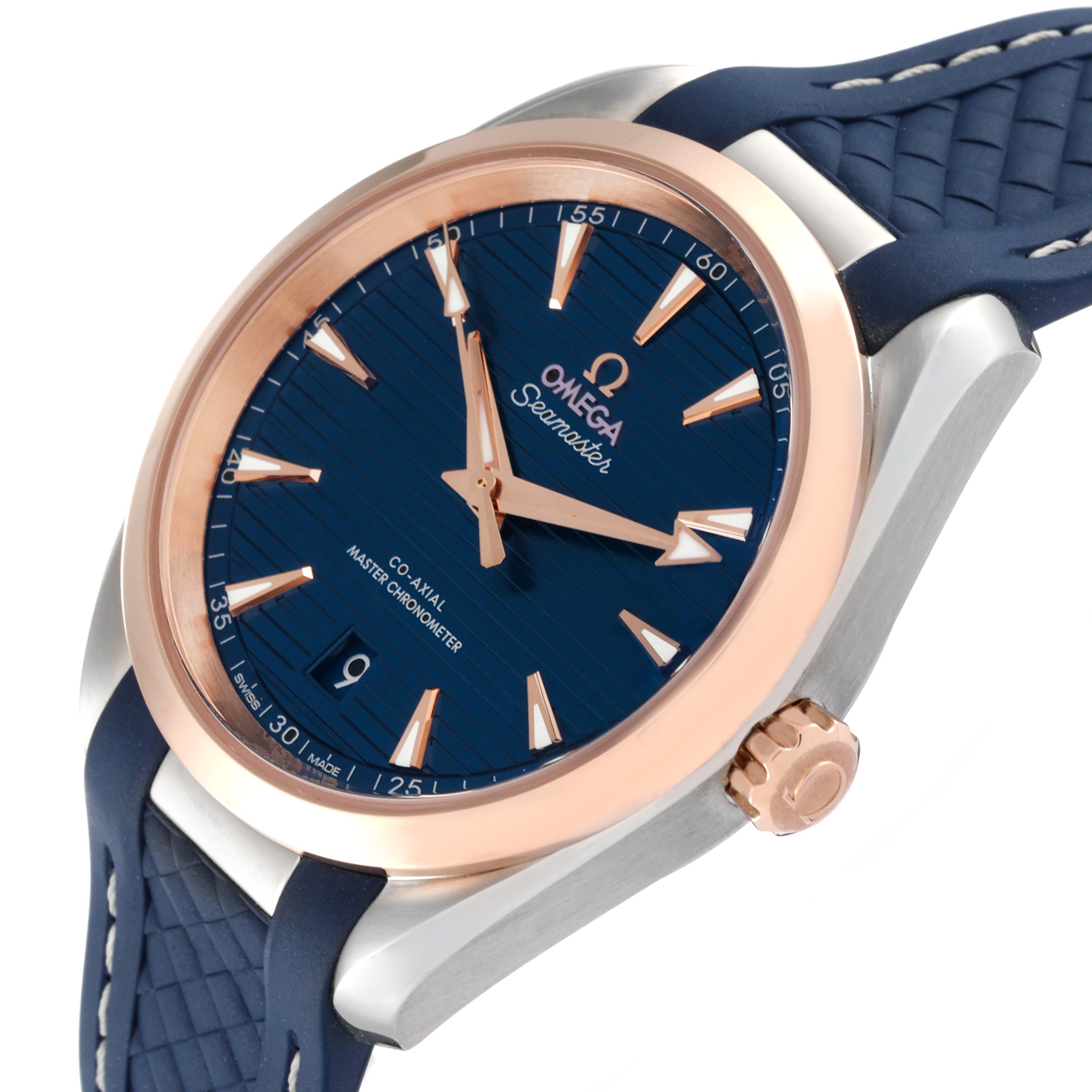 The image shows a side angle of an Omega Aqua Terra 220.23.38.20.03.001 Men's Steel and Gold (two tone) Blue Dial 220.23.38.20.03.001 Men's Steel and Gold (two tone) Blue Dial watch, highlighting the blue dial, rose gold bezel, and crown.