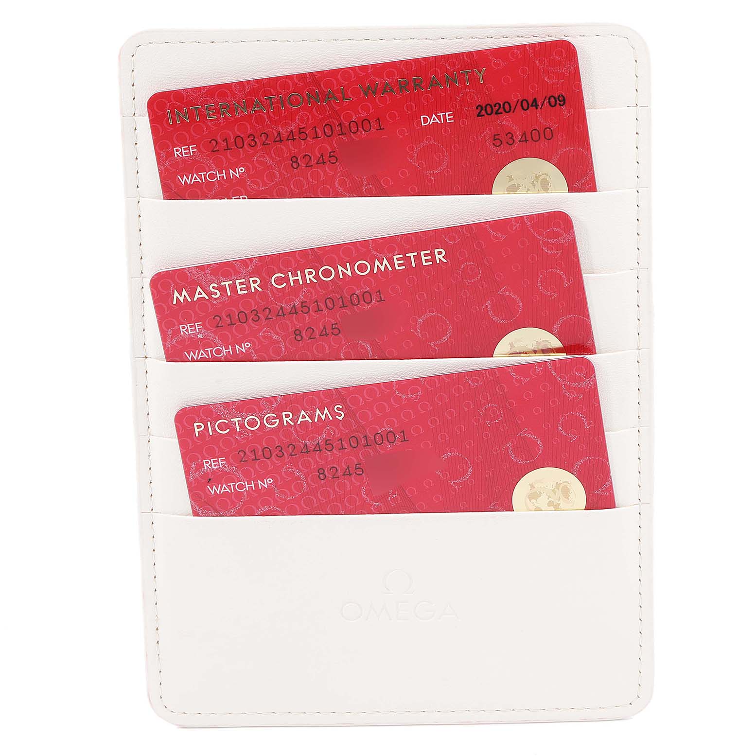 This image shows three red Omega warranty and certification cards for a Seamaster model in a white cardholder.