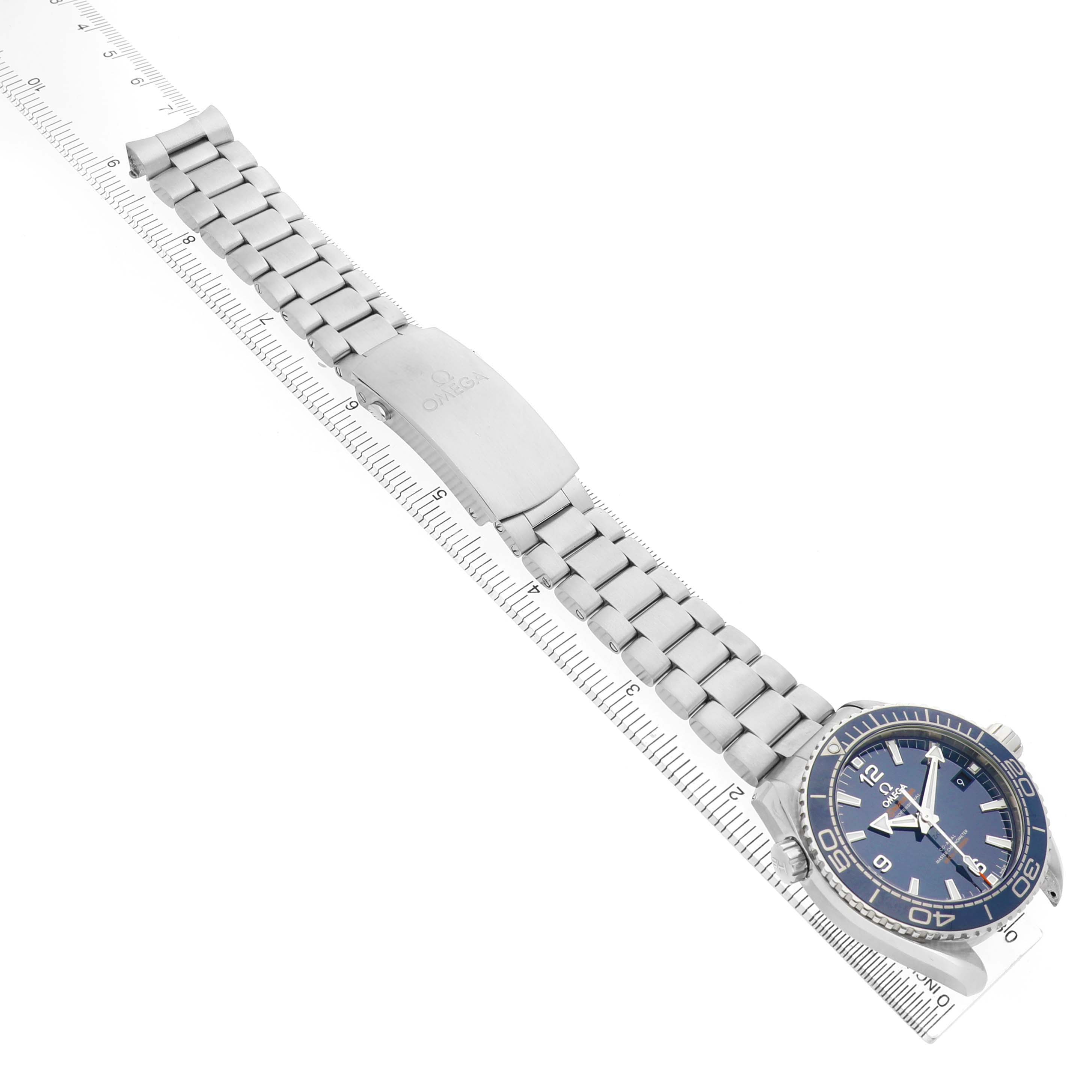 The image shows the Omega Planet Ocean 215.30.44.21.03.001 Men's Stainless Steel Blue Dial watch at a diagonal angle, highlighting the bracelet, clasp, and face.