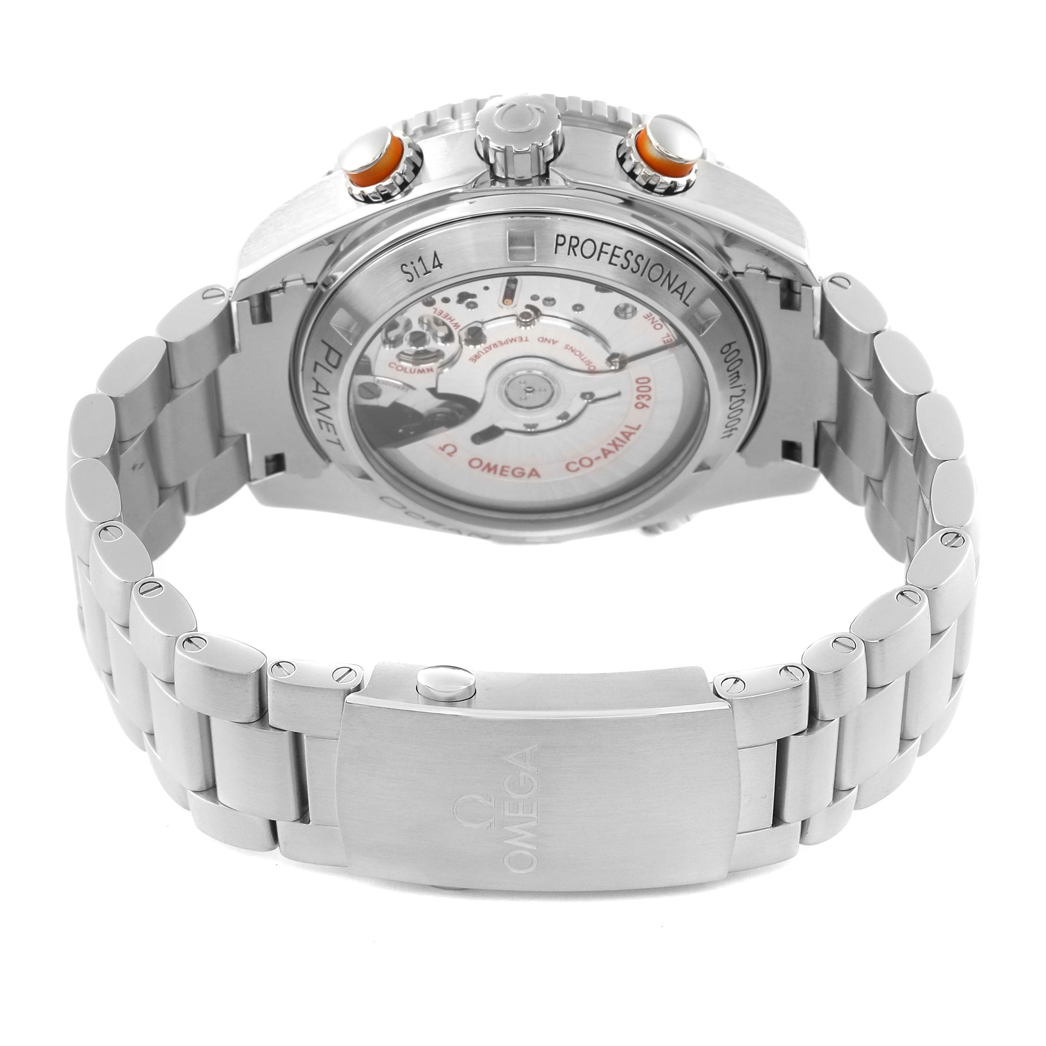 The image shows the back and side of the Omega Planet Ocean 232.30.46.51.01.002 Men
s Stainless Steel Black Dial 232.30.46.51.01.002 Men
s Stainless Steel Black Dial watch, highlighting its bracelet, buckle, and visible inner mechanisms.